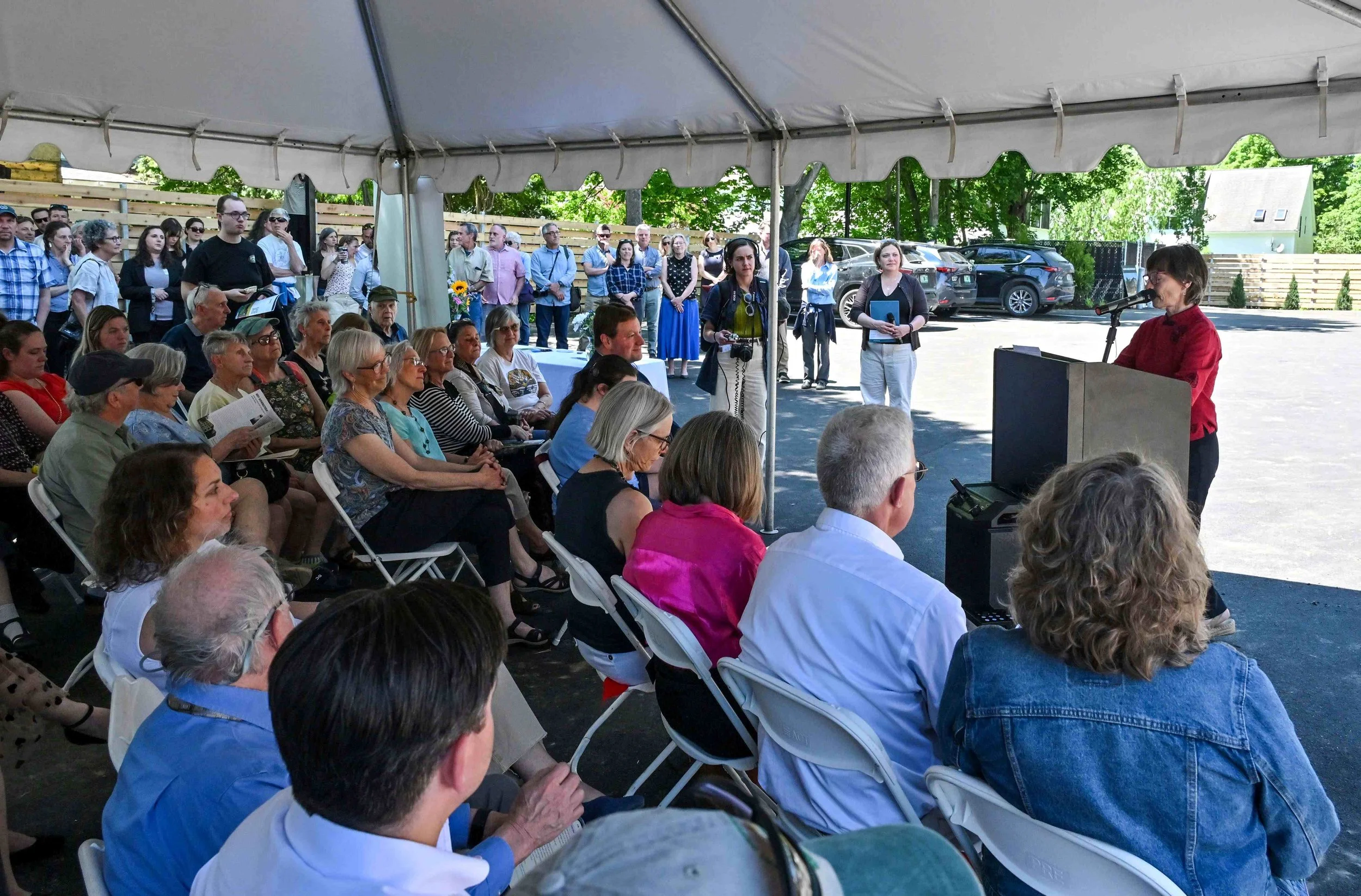  Downstreet Housing &amp; Community Development Board Chair Pegeen Mulhern starts the ceremony. Photo by Gordon Miller 