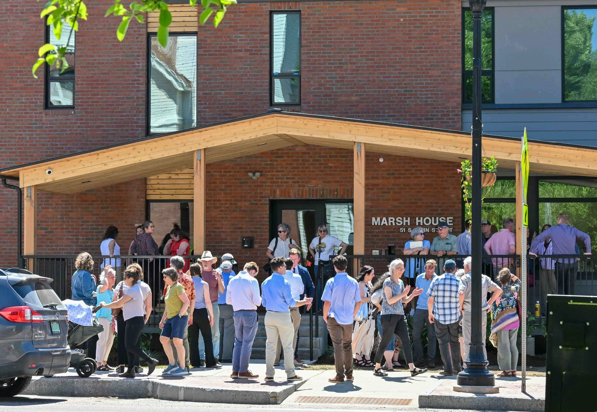  The crowd gathers at the front entrance for the ribbon-cutting. Photo by Gordon Miller 