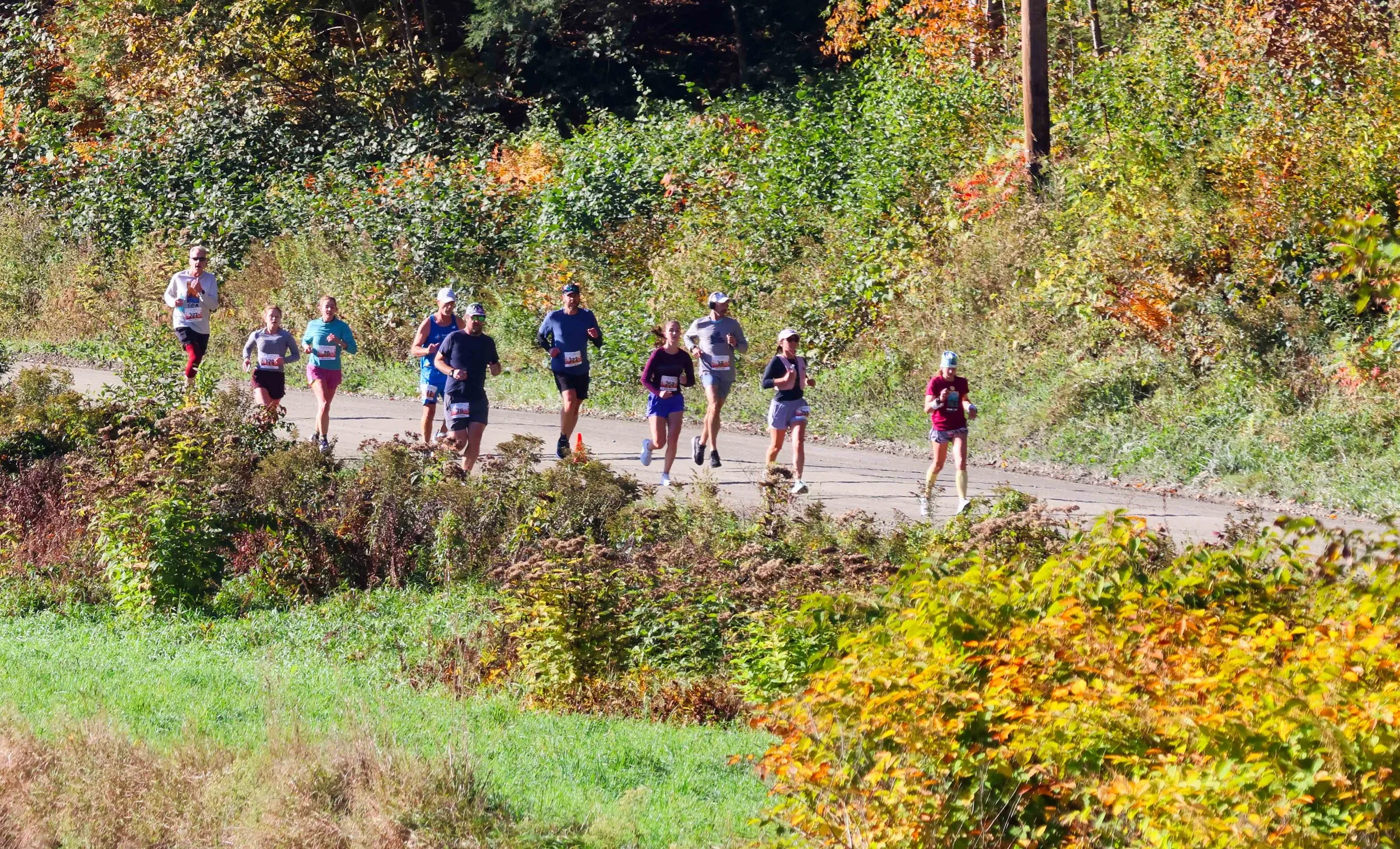   Runners make their way down River Road in Duxbury. Photo by Gordon Miller  