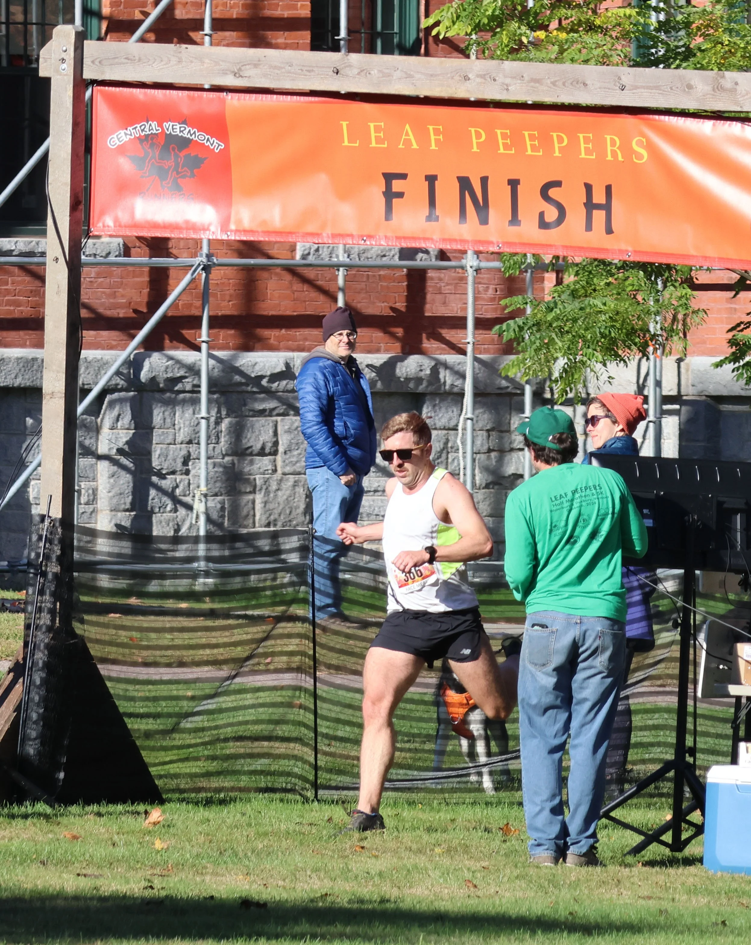   5K winner Jonnie Dunne at the finish line. Photo by Gordon Miller  