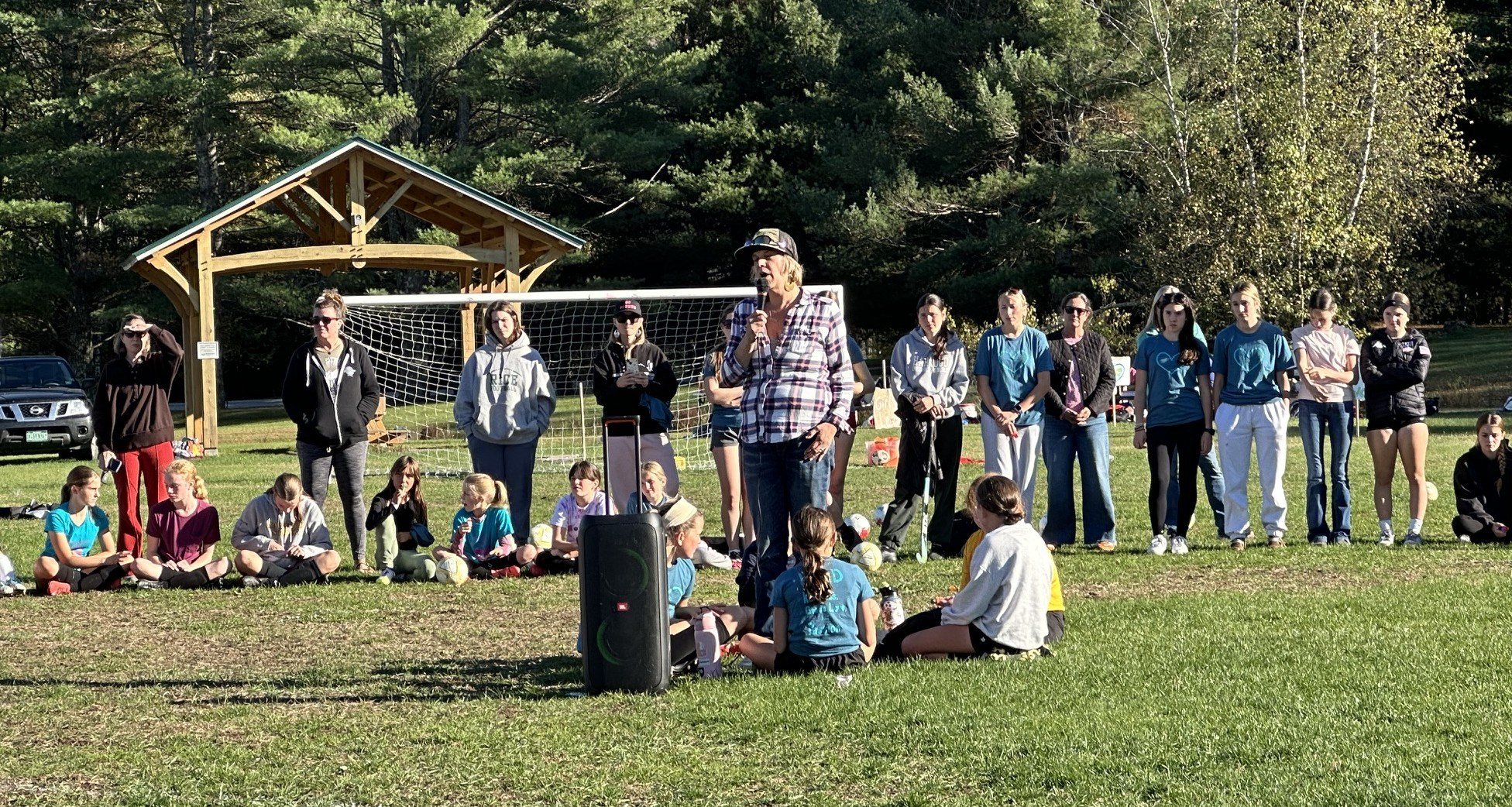  Liz Harris addresses the crowd of girl soccer players at Mary Harris Day 2025. Photo by Lisa Scagliotti  