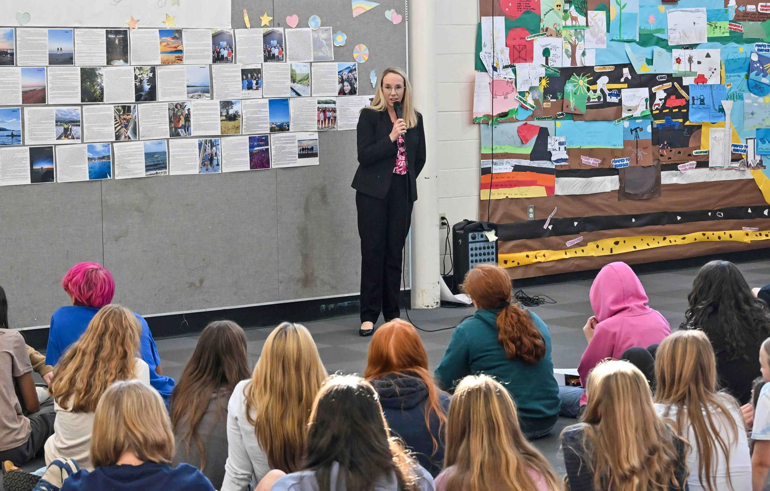  Education Secretary Zoie Saunders addresses Harwood 7th and 8th grade students. Photo by Gordon Miller  