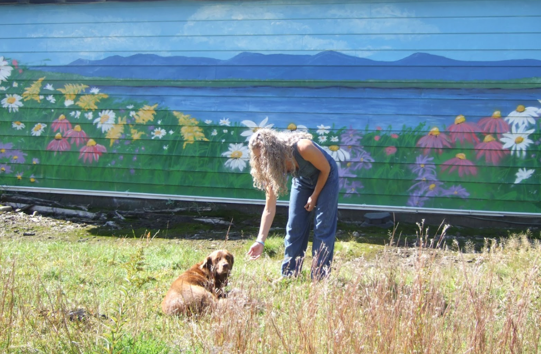 Artist paints flowers-and-mountains mural off the beaten path ...