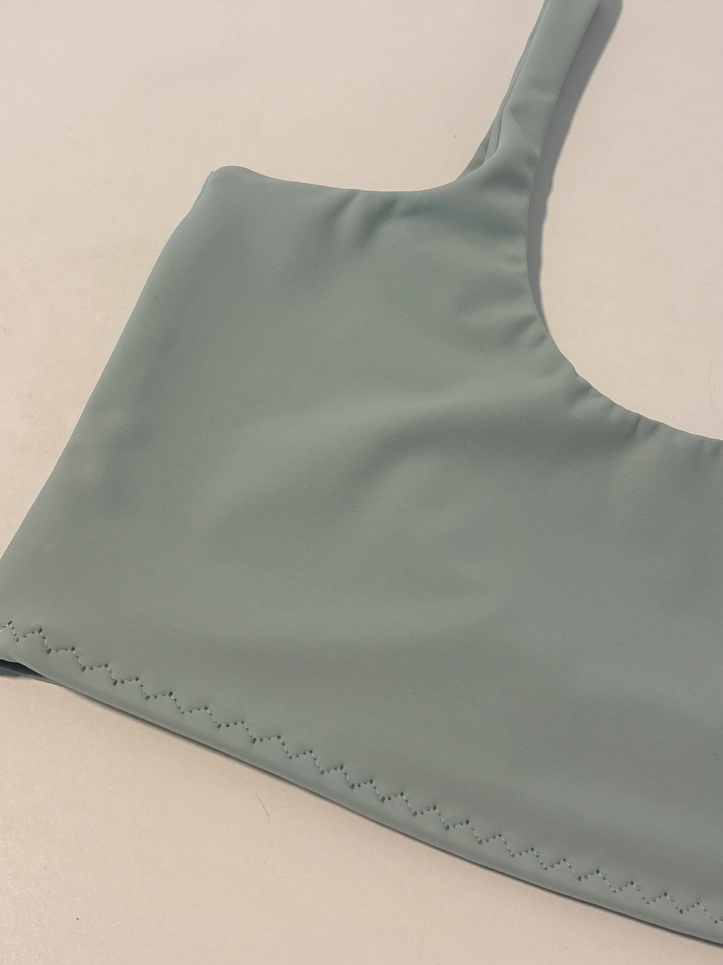 Smokey Sage- Recycled Pollyester and Spandex mix. Chlorine and UV resistant
