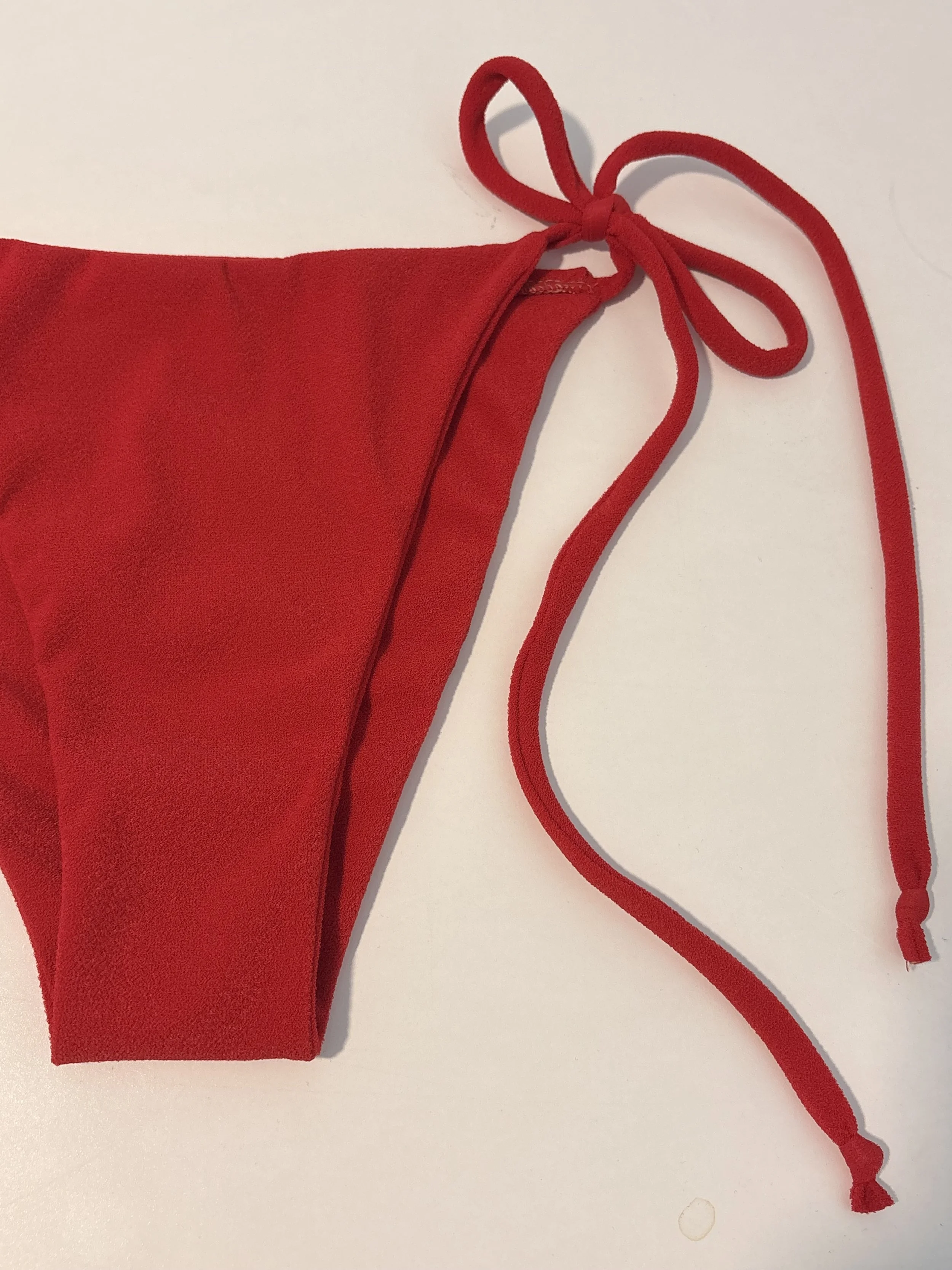 Red Terry- A textured blend of recycled pollyester and spandex. UV and Chlorine resistant. 