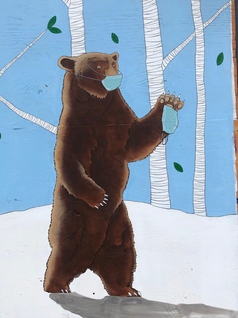 mural of bear wearing mask