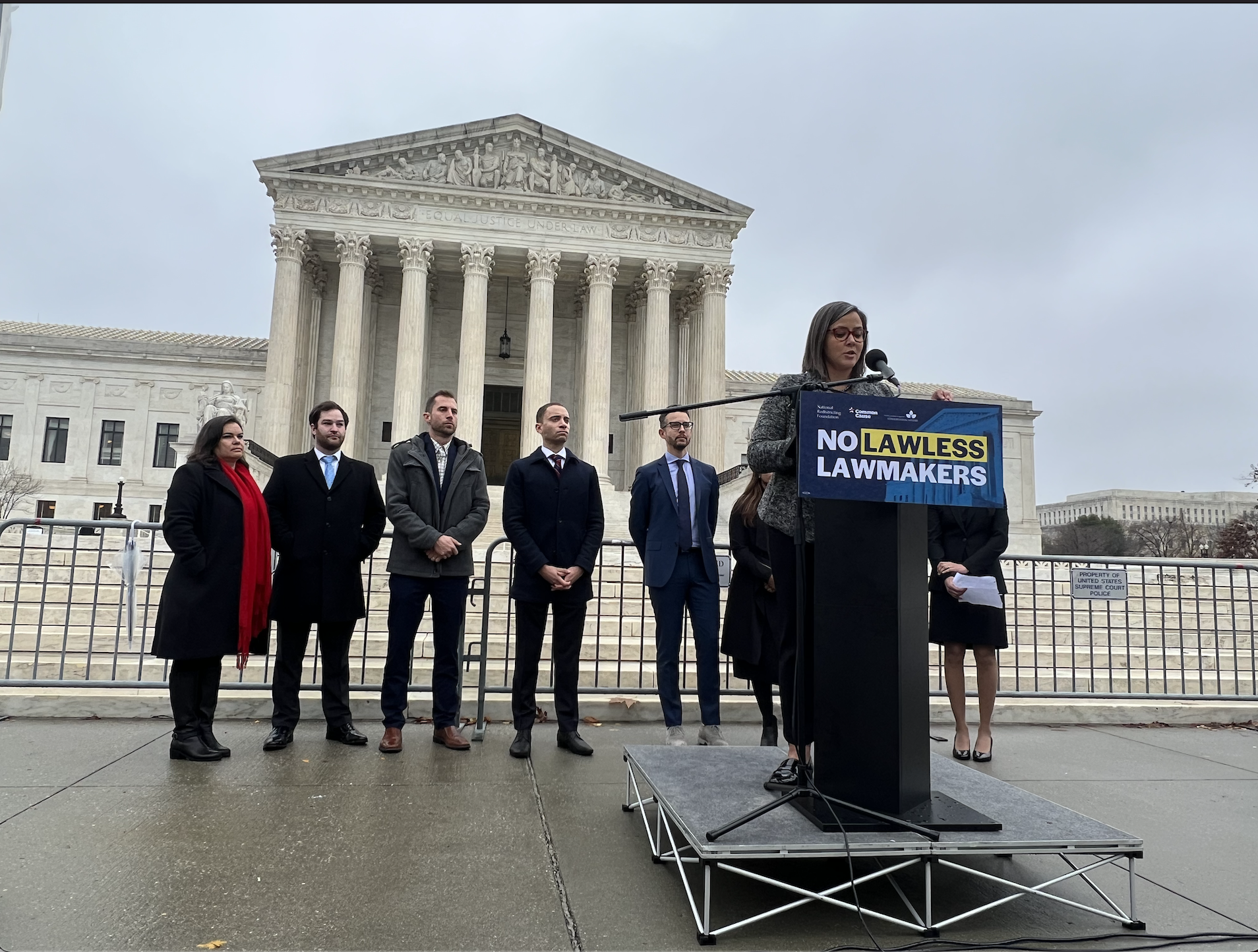  Pictured left to right: Olivia Mendoza, NRF’s Deputy Director of Litigation and Policy, Matt Mengert, NRF’s Legal and Policy Analyst, Brent Ferguson, NRF’s Senior Counsel, Graham White, Elias Law Group, Stanton Jones, Arnold & Porter, [Two people not pictured: Lali Madduri and Jacob Shelly, ELG], Marina Jenkins, NRF’s Director of Litigation and Policy and Abha Khanna, Partner at Elias Law Group and Counsel of Record for Harper Respondents, stand outside of the Supreme Court to speak with reporters following the oral argument in  Moore v. Harper  on December 7, 2022. 