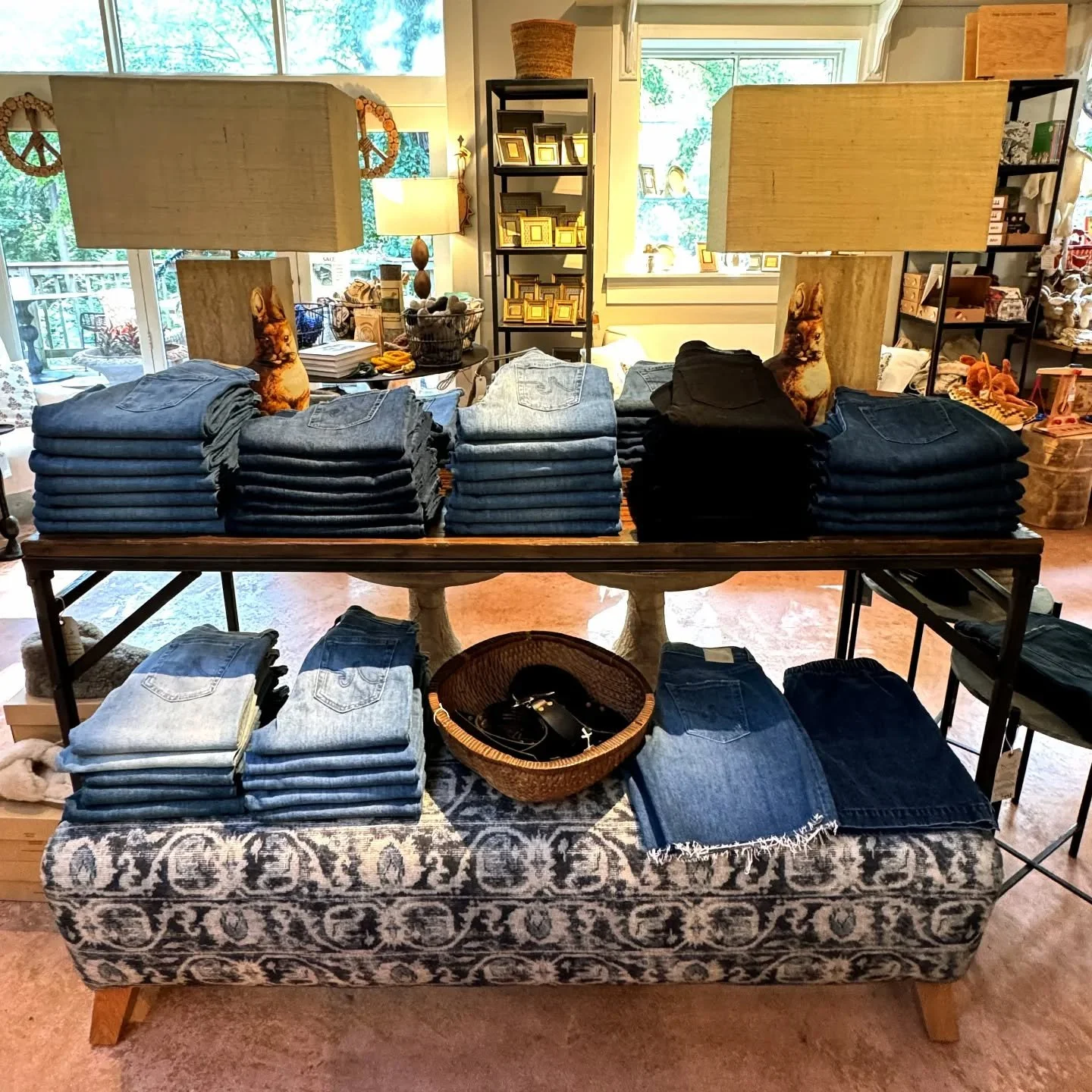 @agjeans table is full.  Great belts too.  And what about that gorgeous @myciscohome bench, perfect for head of bed or in front of a sofa. #blue #indigo #newstyles #furniturestore #amazinglamps #giftsforall #artisangoods #sustainableliving #openevery