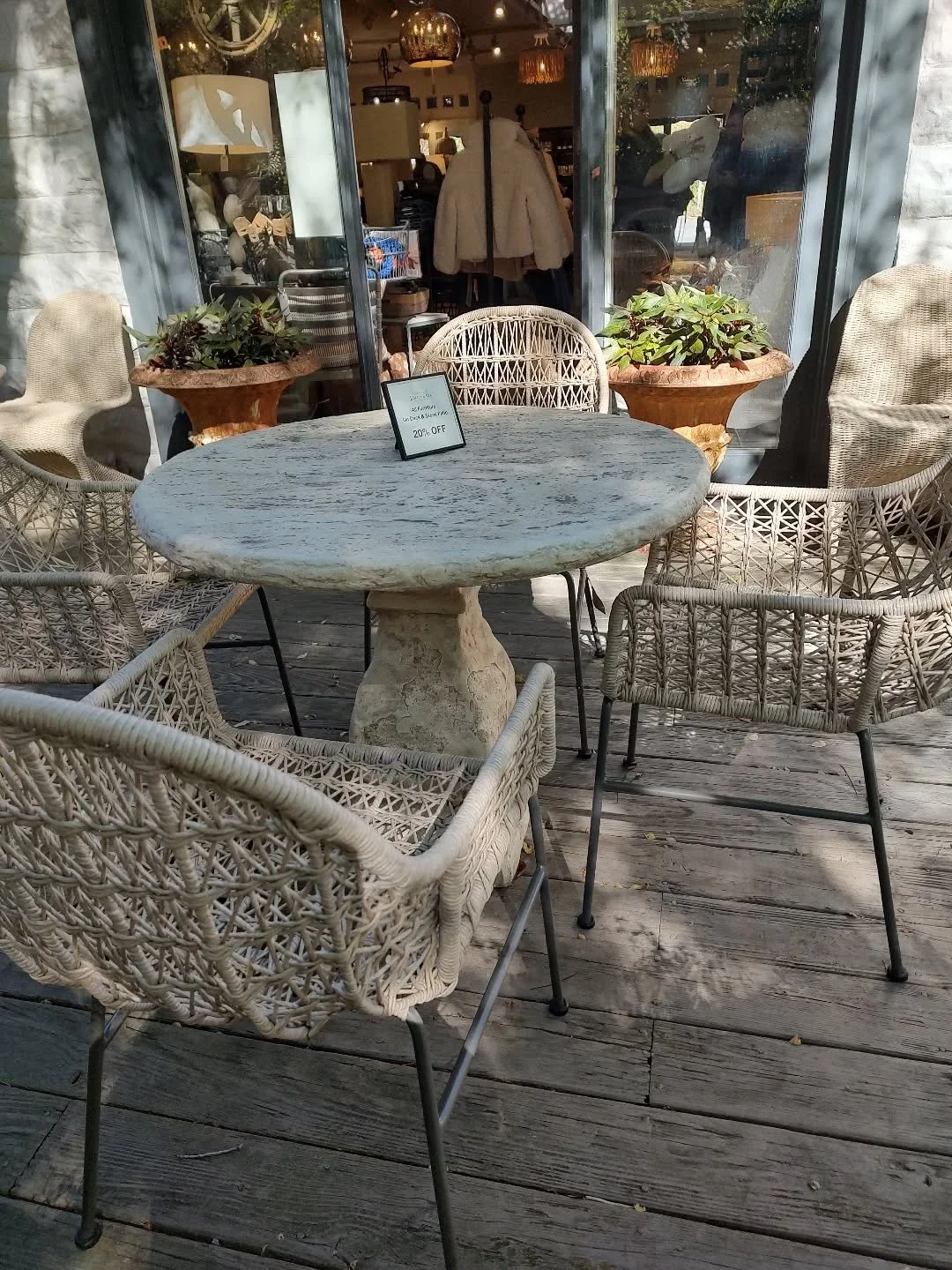 A couple of outdoor stone tables and chairs left on our deck.  You can leave these out all year long.  Easy care and sale priced!  These gorgeous stone tables would also make great sofa side pieces.  #sustainableliving #outdoors #sal&eacute; #38years