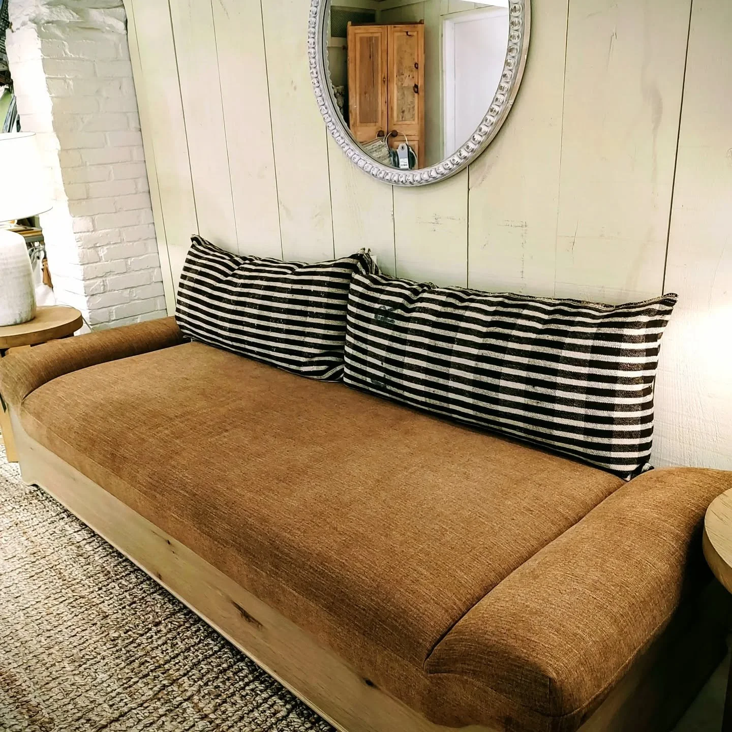 If you need an extra bed but don't have room for one, this Danish Chaise will sleep one very tall person!  It's also perfect as a divider between the living room and dining room.  Wood base and chic linen upholstery.  # furnitureinstock #takeithome #