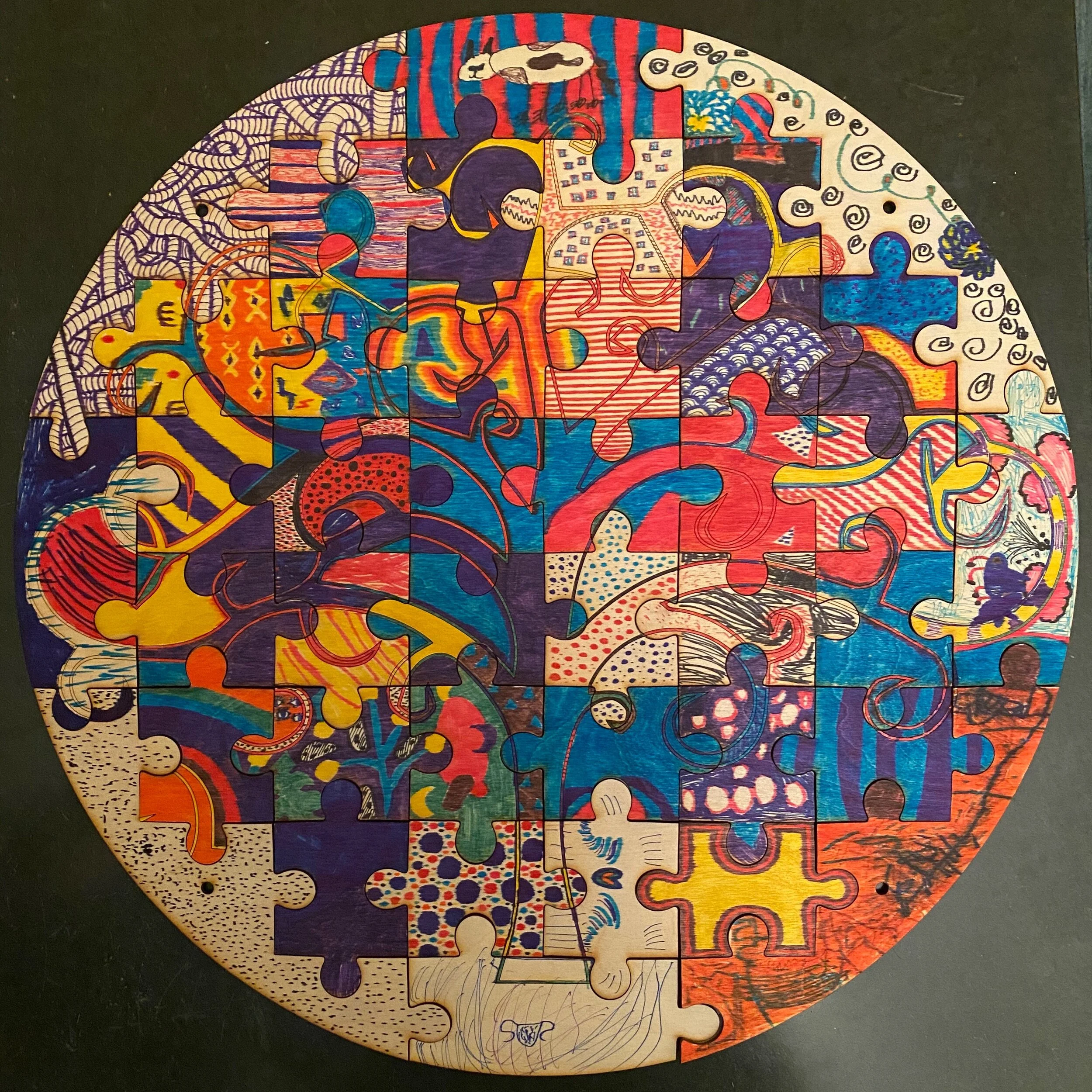 Puzzle made by family - mix of kid and adult art