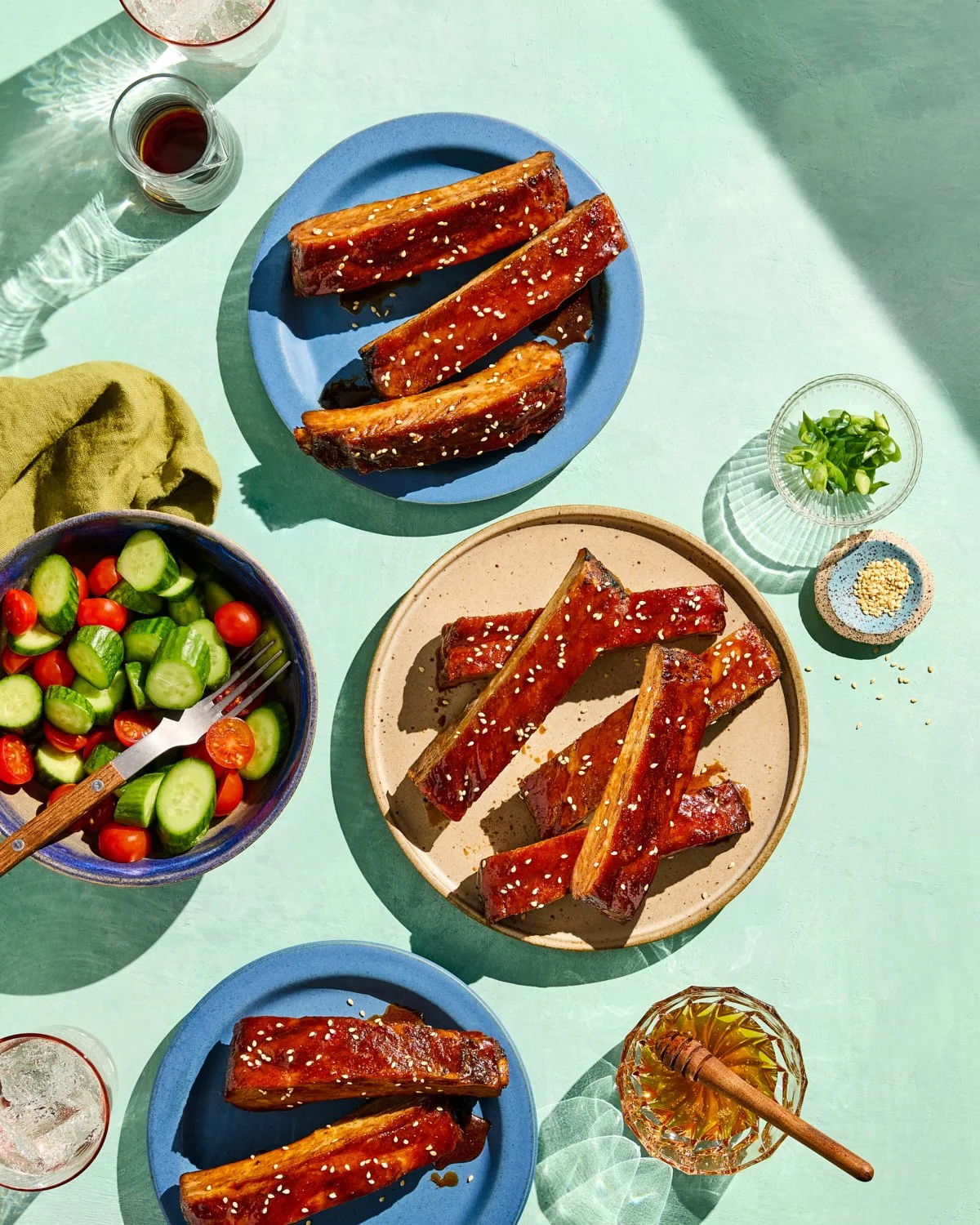 Grilled soy sticky pork spare ribs styled with bold sauces and sides for National Pork Board.