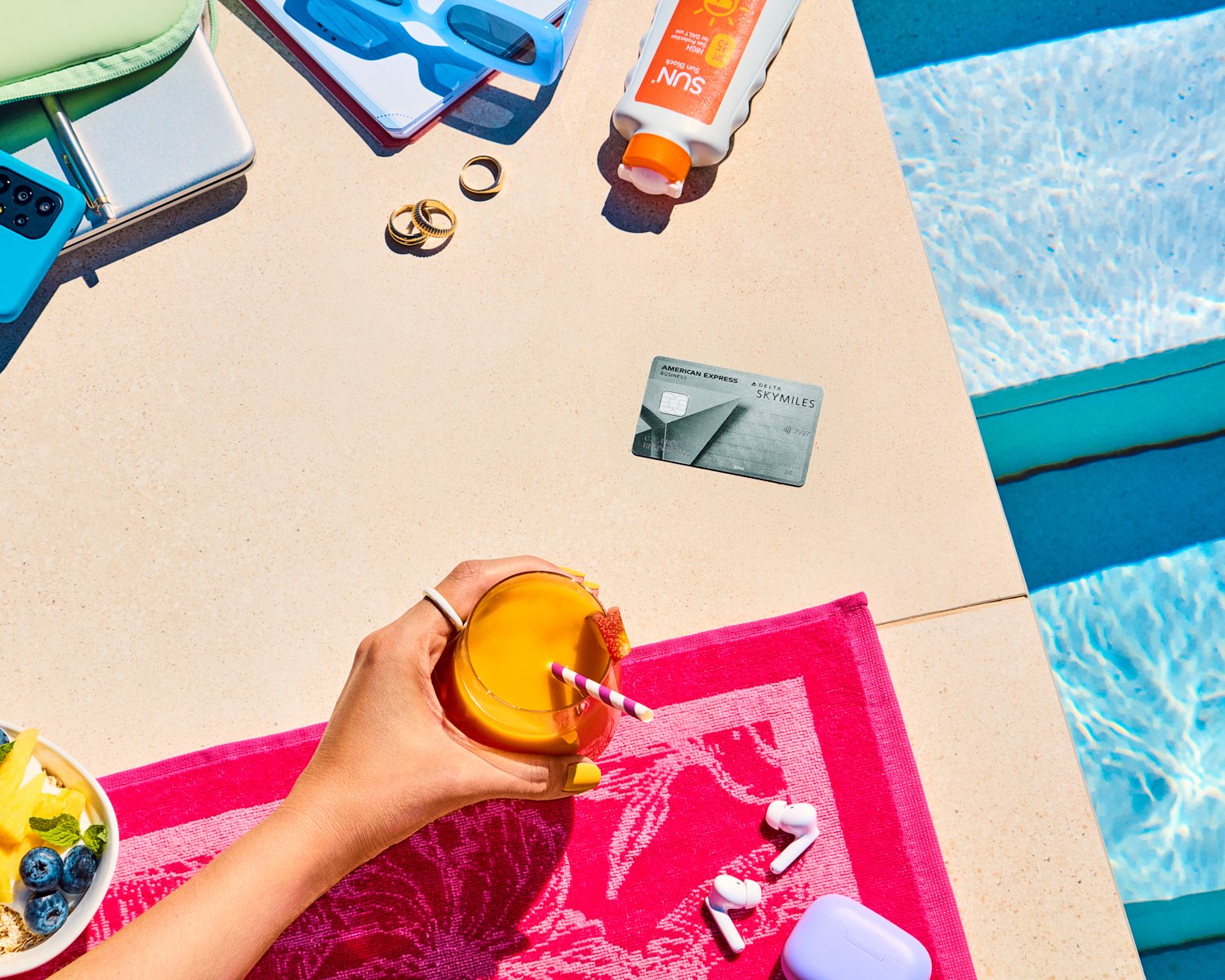 American Express and Delta Platinum card photographed poolside for the 100-year campaign.