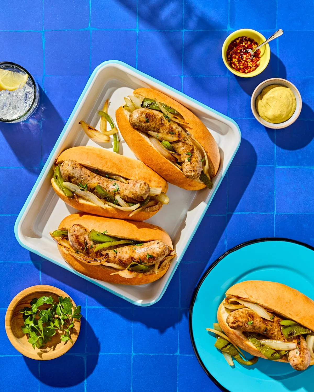 Grilled sausage grinders with onions and peppers for National Pork Board recipe photography.