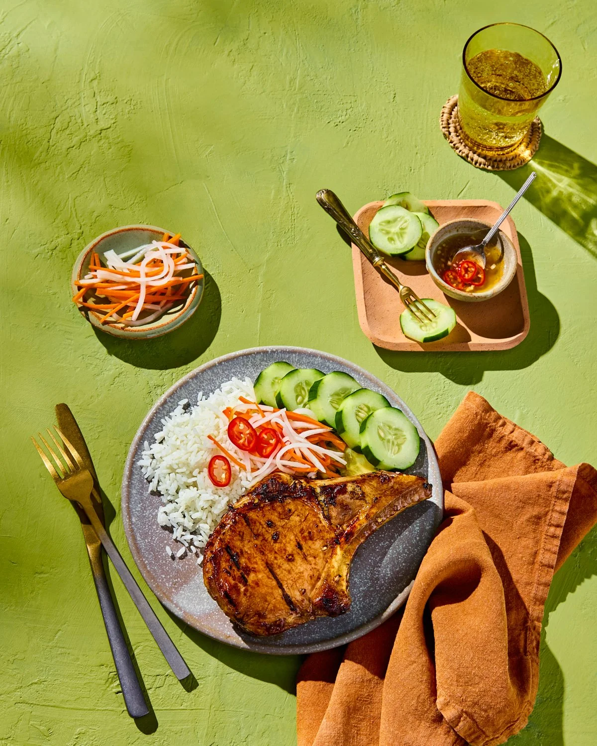 Vietnamese grilled lemongrass pork chops with rice and fresh garnishes for National Pork Board.