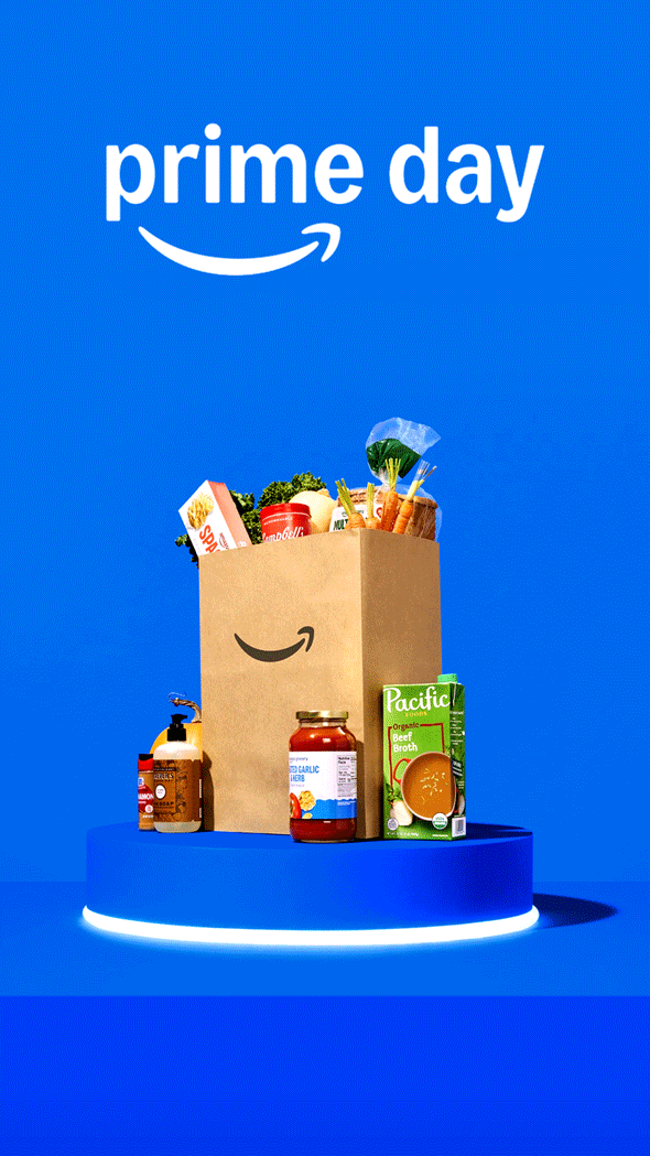 Amazon Fresh delivery bag displayed on a pedestal with fall groceries for Prime Big Deal Days.