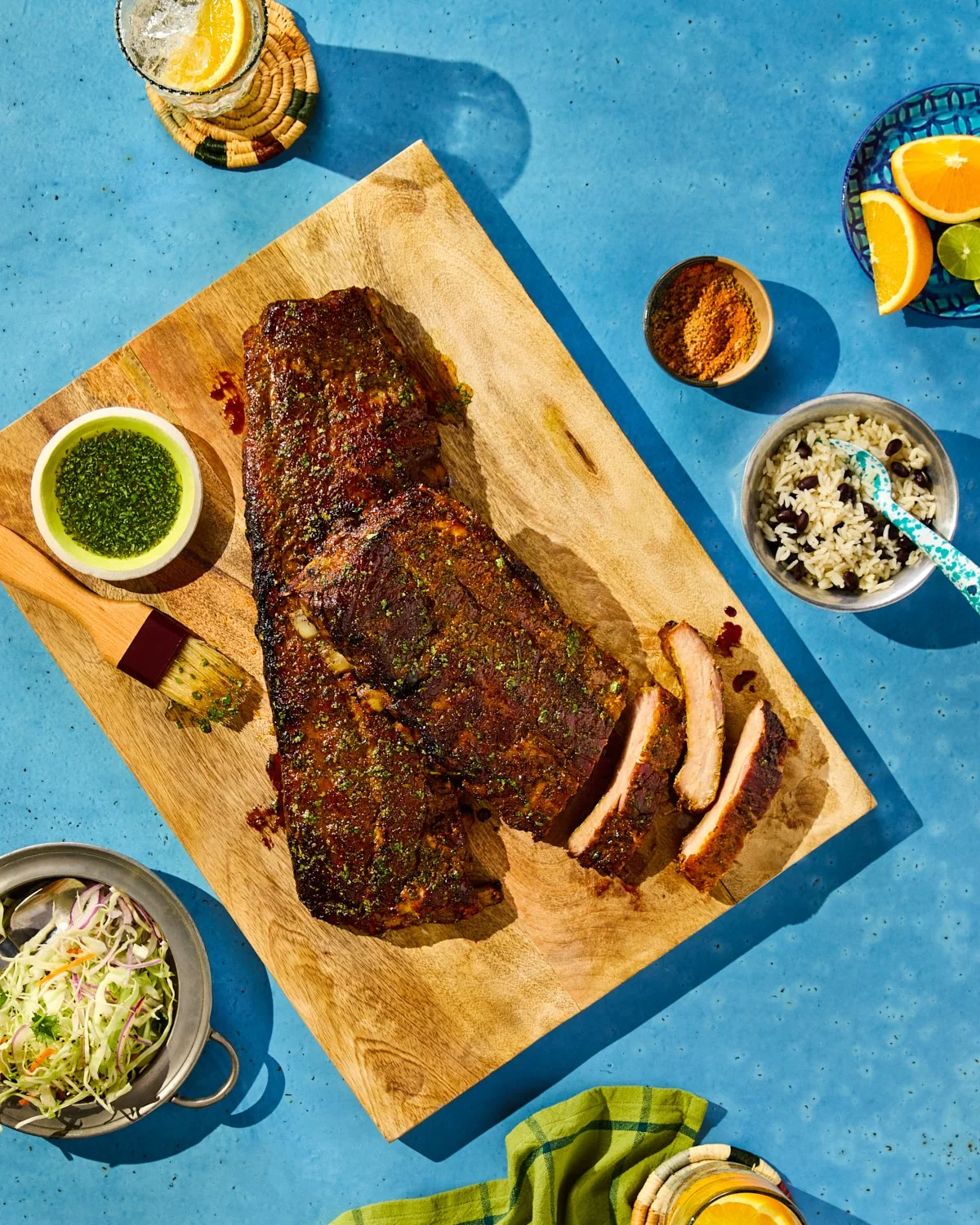 Cuban mojo grilled baby back ribs styled with bold color for National Pork Board.