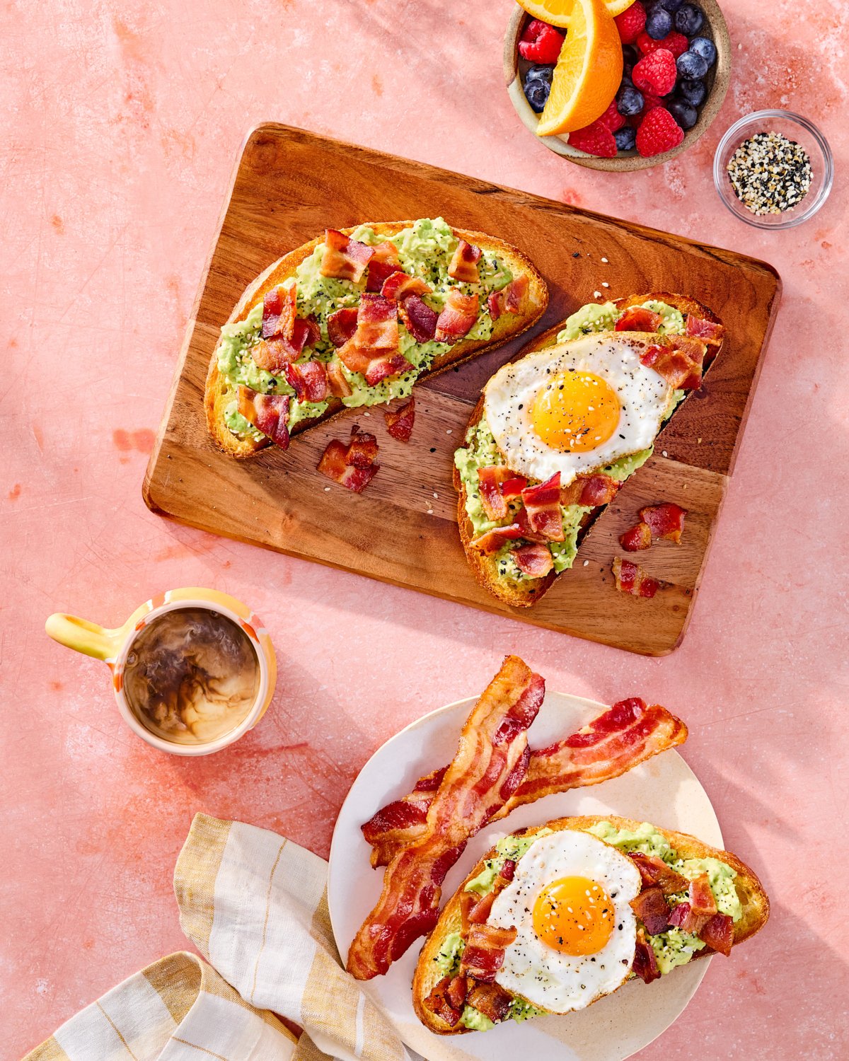 Everything bacon avocado toast with fried egg and colorful breakfast styling for National Pork Board.