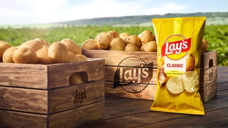Commercial brand photography for Lay’s shot on a working potato farm in New Mexico, capturing open fields, soil texture, and natural light tied to the brand’s Rooted in Real campaign.