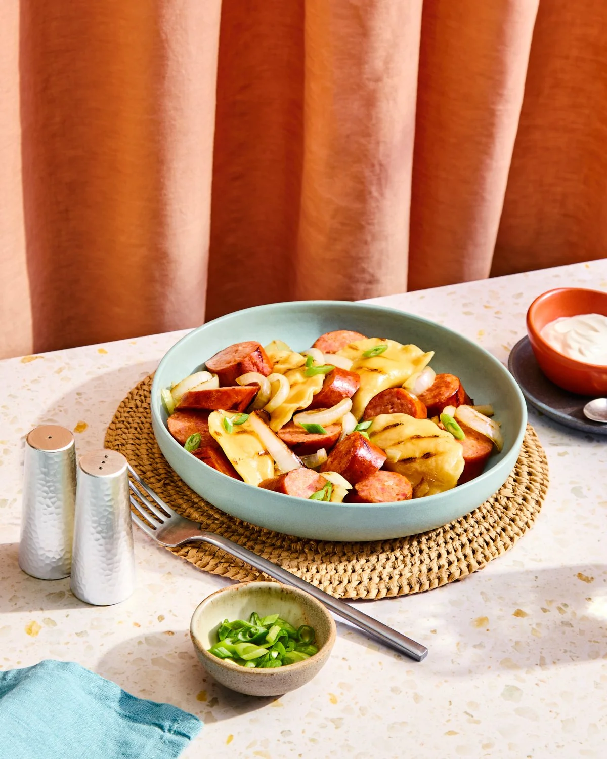 Grilled kielbasa and pierogies with bright tabletop styling for National Pork Board.