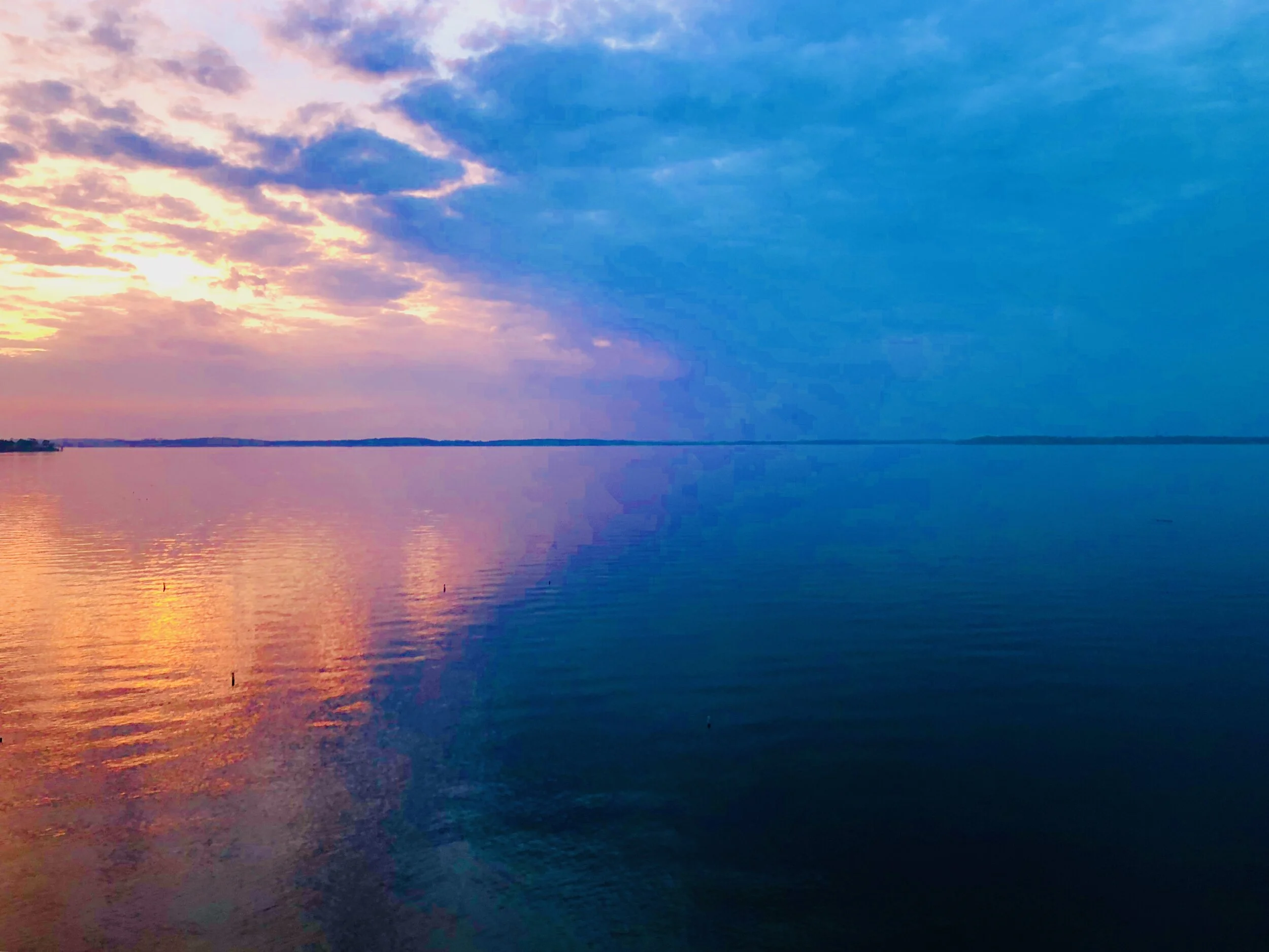 Sunlight slanting across a body of water. photo credit:  Jennifer Stitt