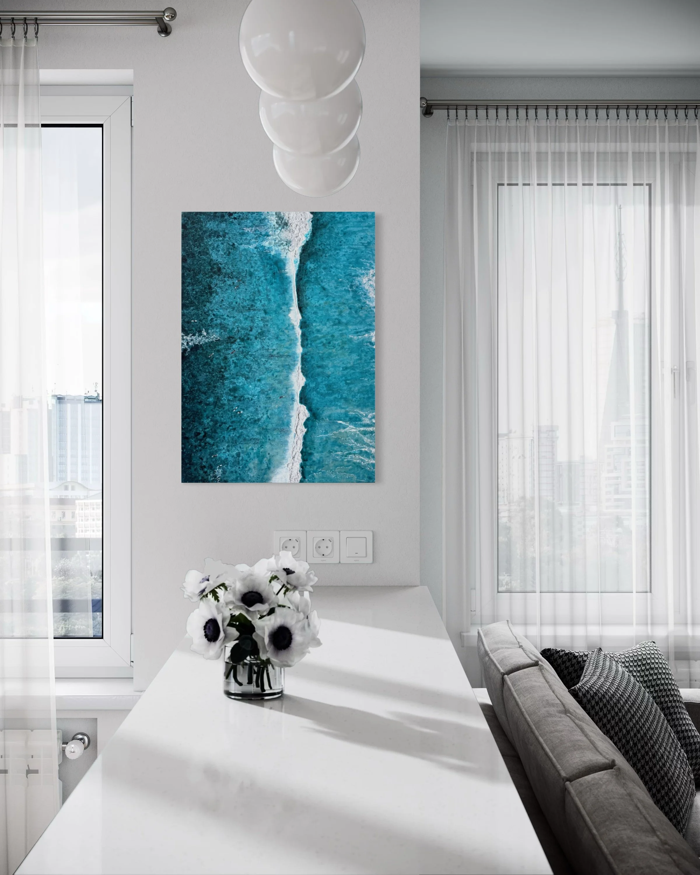 Paddle Out at Watergate Bay canvas print hanging above a white kitchen counter in a bright open-plan room