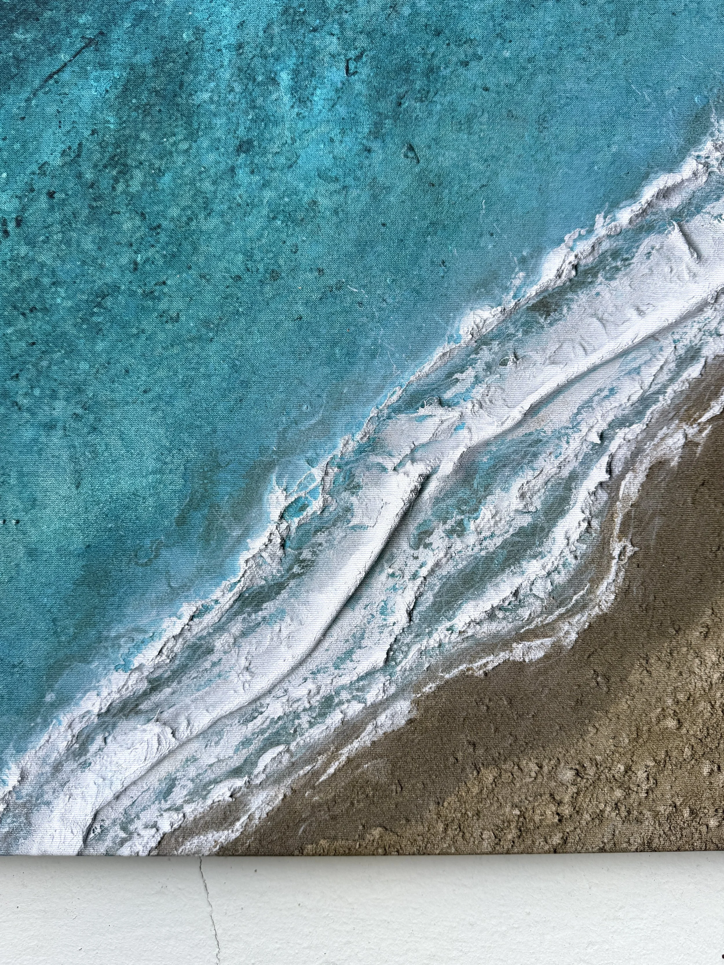 Close-up of the printed foam and sand texture on the Moments on the Shoreline canvas