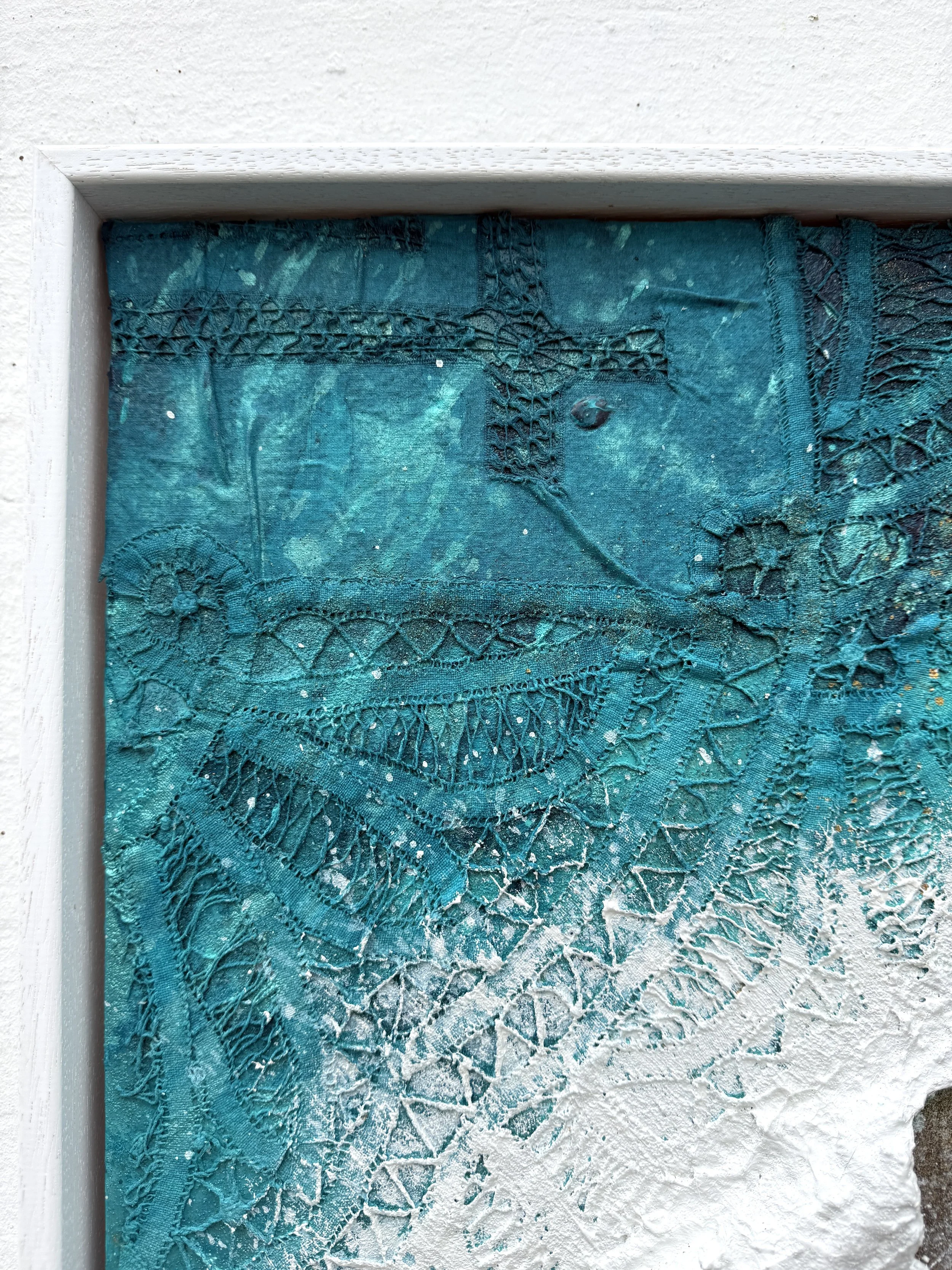 Close-up of lace from the artist’s grandmother’s tablecloth forming the turquoise water in Woven in the Waves I