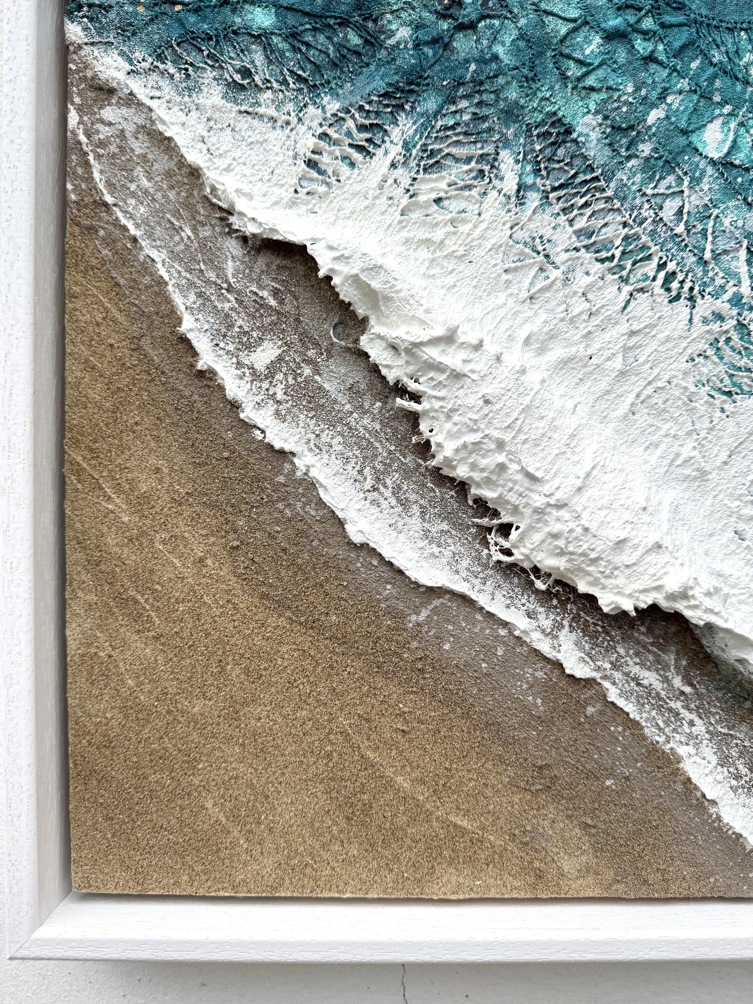 Close-up of sand on shoreline of Woven into the Waves II
