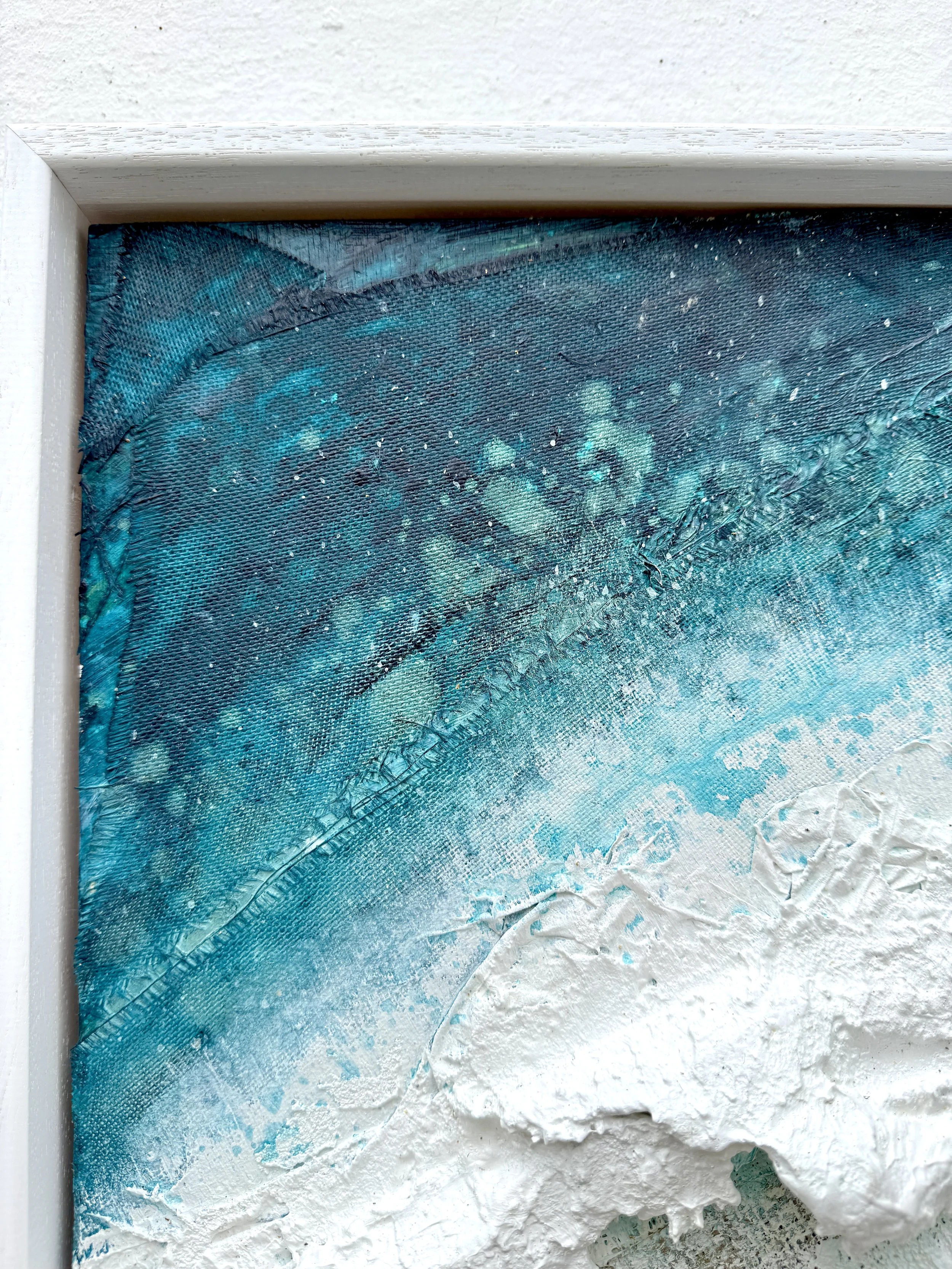 Closeup of fibreglass and fabric detail showing threads in the ocean water