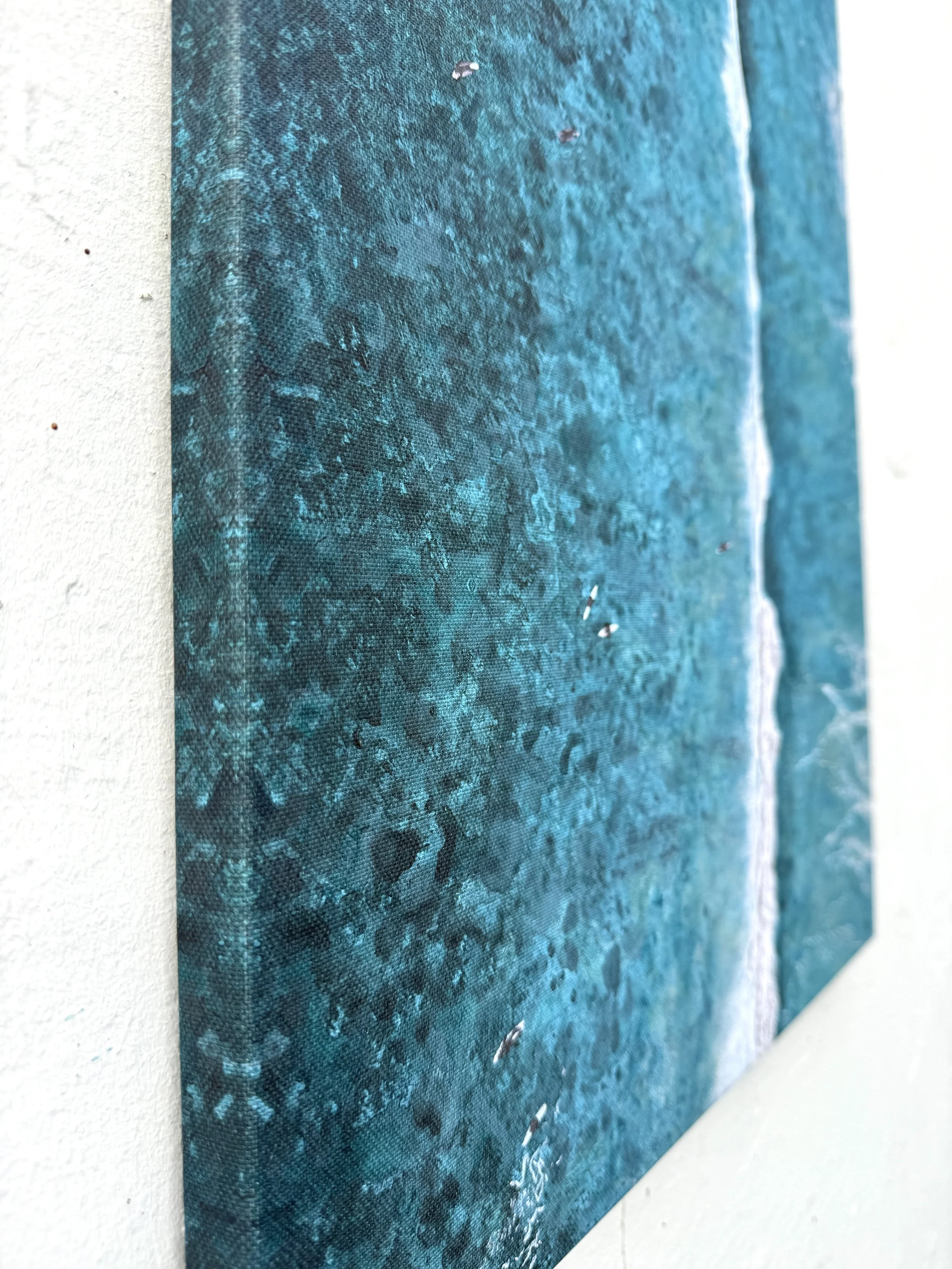 Angled view of the 2cm gallery-wrapped edge of the Paddle Out canvas