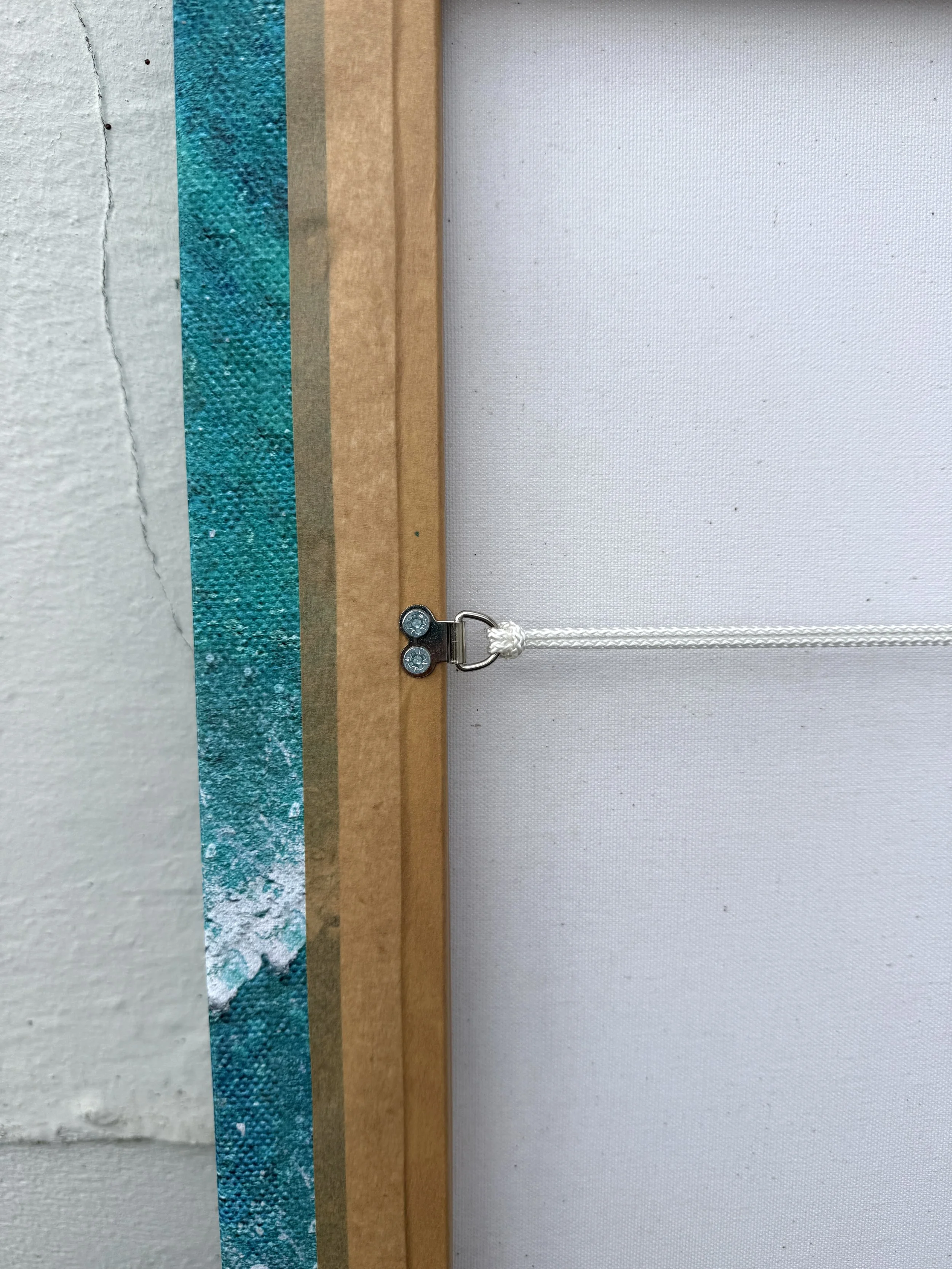 Back of the Summer Swell canvas showing the hand-stretched frame and hanging cord