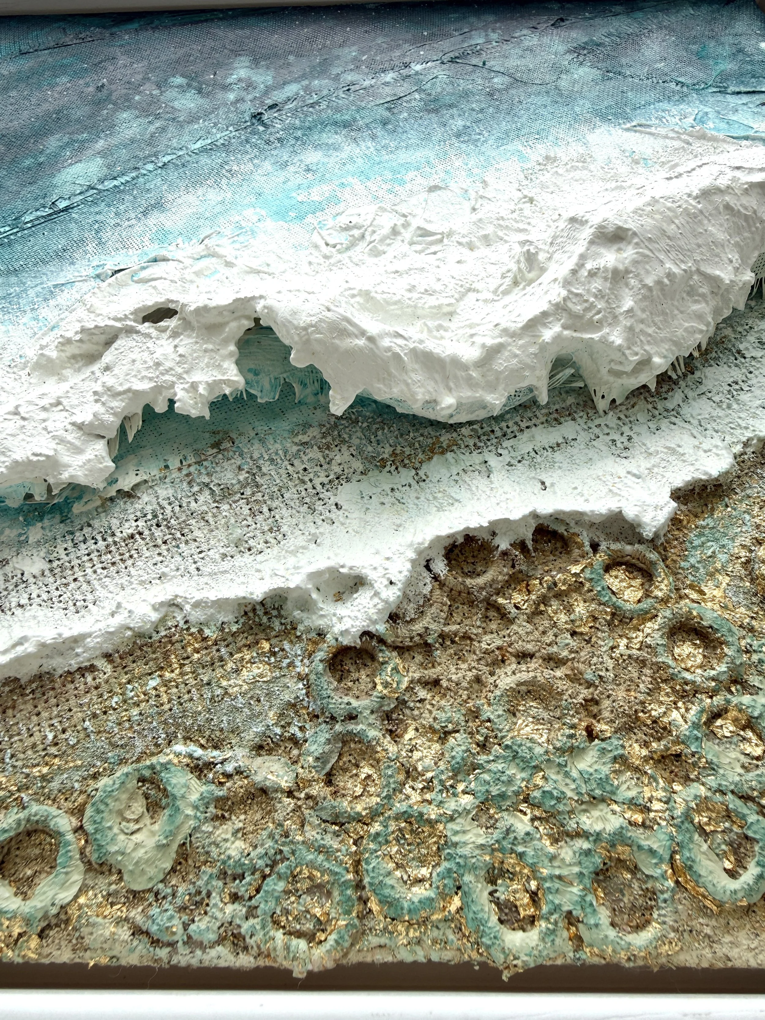 Close-up of sculpted surfboard fibreglass white water in Washed in Gold