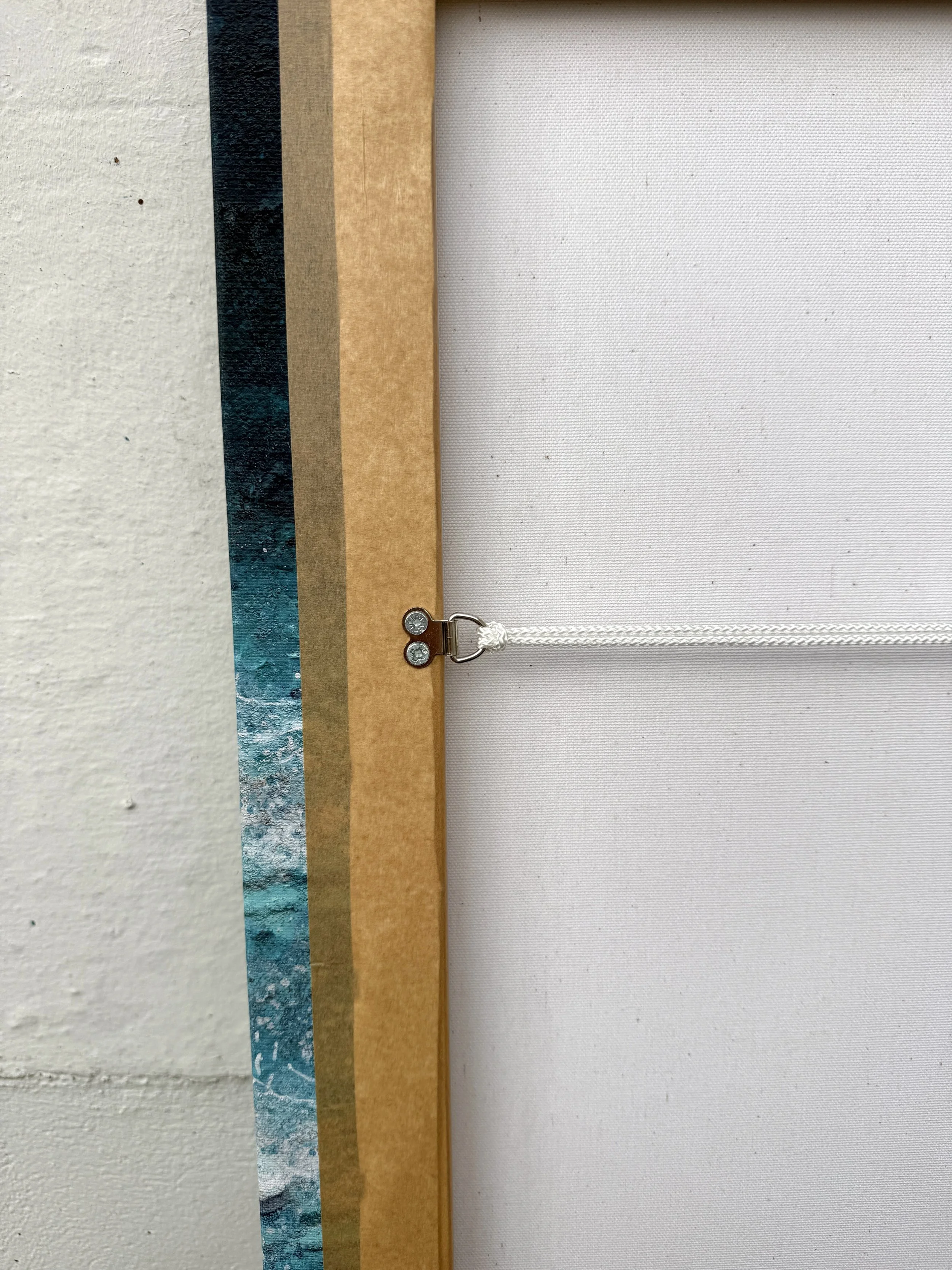 Back of the White Water at Fistral canvas showing the hand-stretched frame and hanging cord