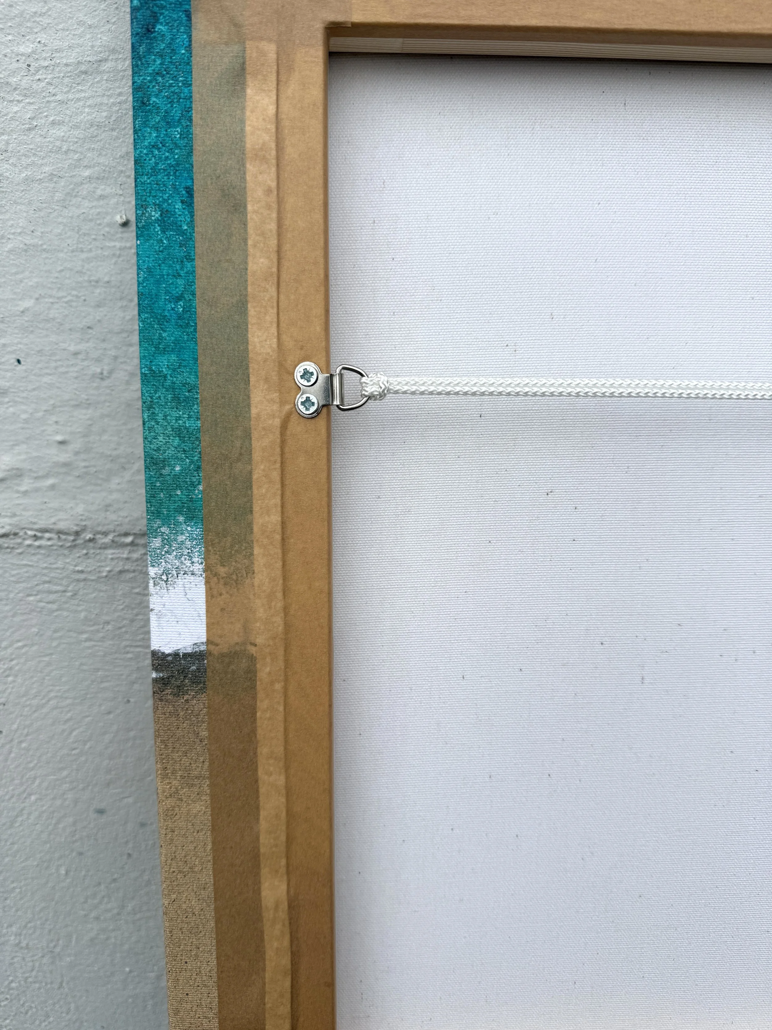 Back of the Mother Ivey's Bay canvas showing the hand-stretched frame and hanging cord