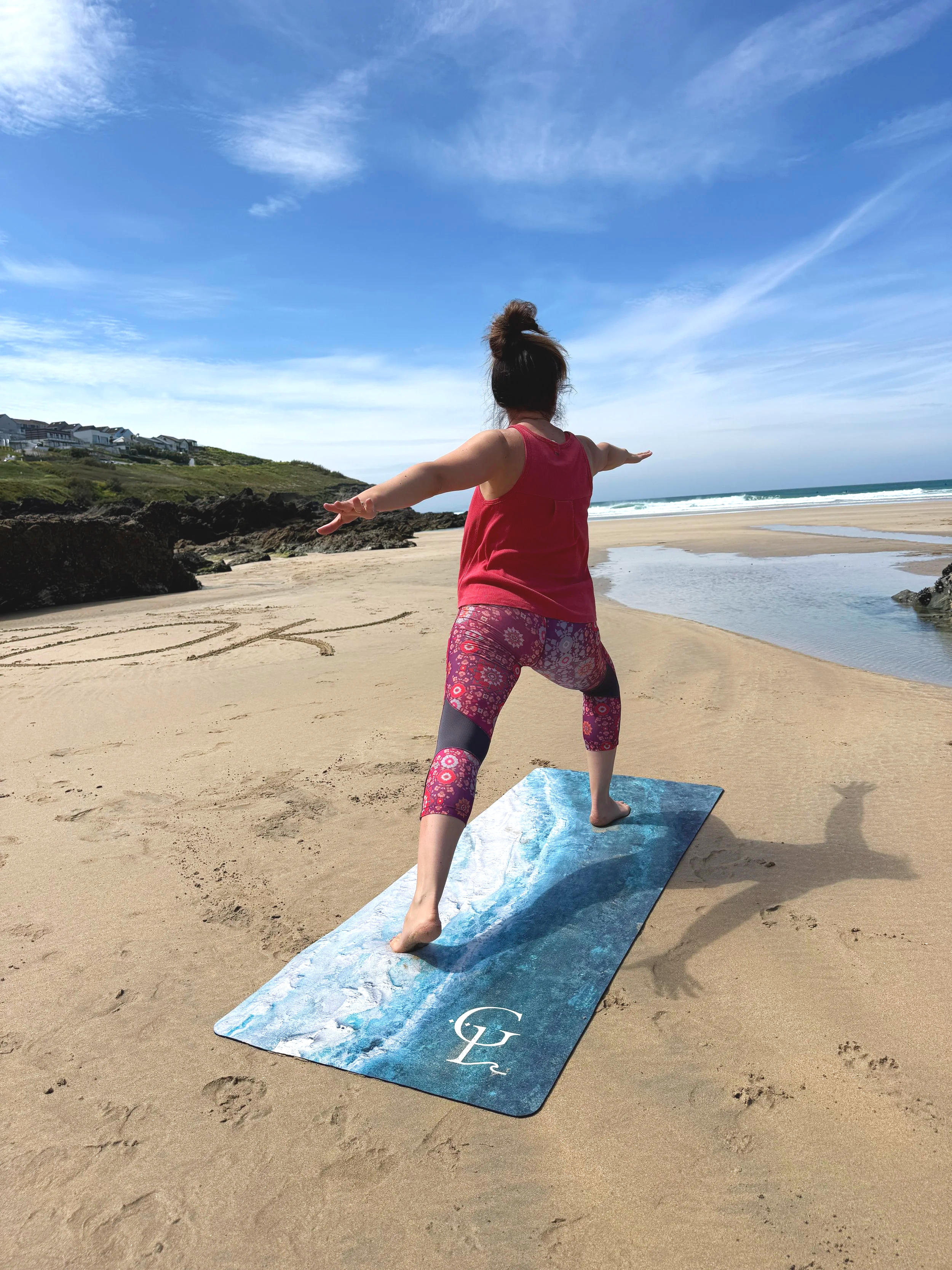 Swell off Shore at Fistral yoga mat shown in yoga pose on beach
