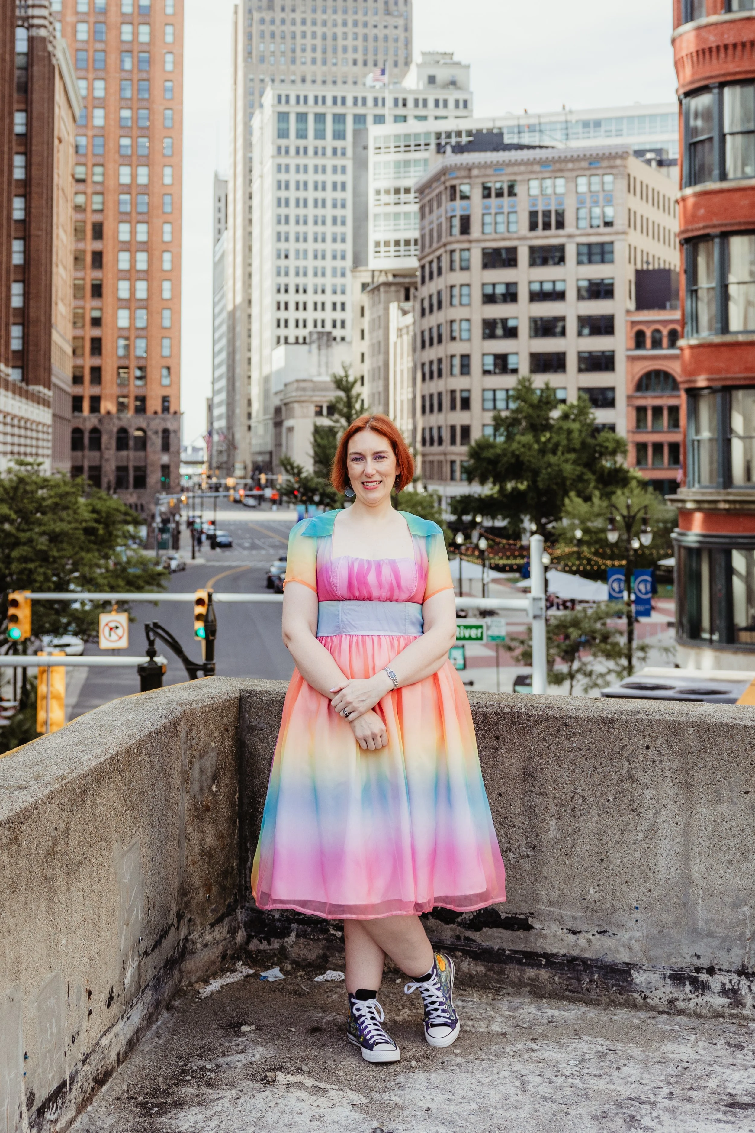 Photo of Jenella with Detroit skyline in background. Image taken by Smitten Mitten Photography.