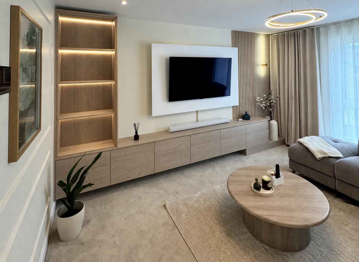 Living room after bespoke media wall and joinery design