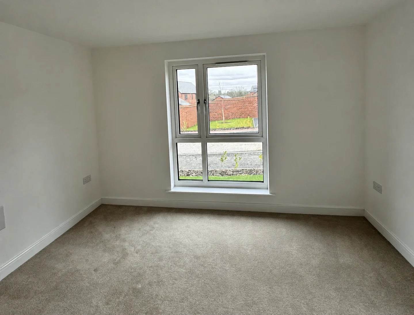Living room before bespoke media wall transformation