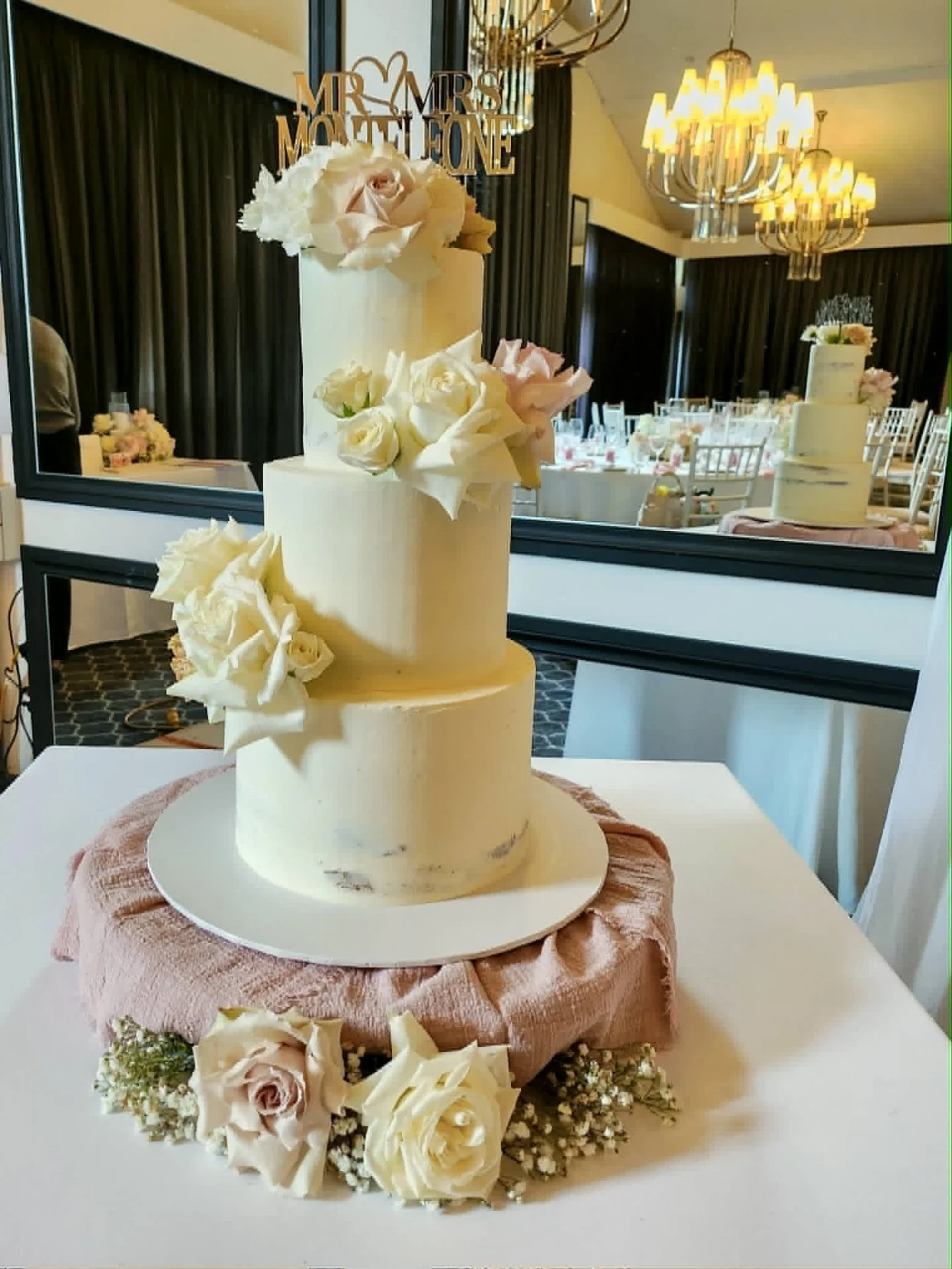 Three tiers. Three flavours. One very happy cake designer.

White choc banana, chocolate and gluten free white choc strawberry in the most beautiful semi naked finish, dressed in the softest blush and cream roses for the stunning Rachel &amp; Domenic