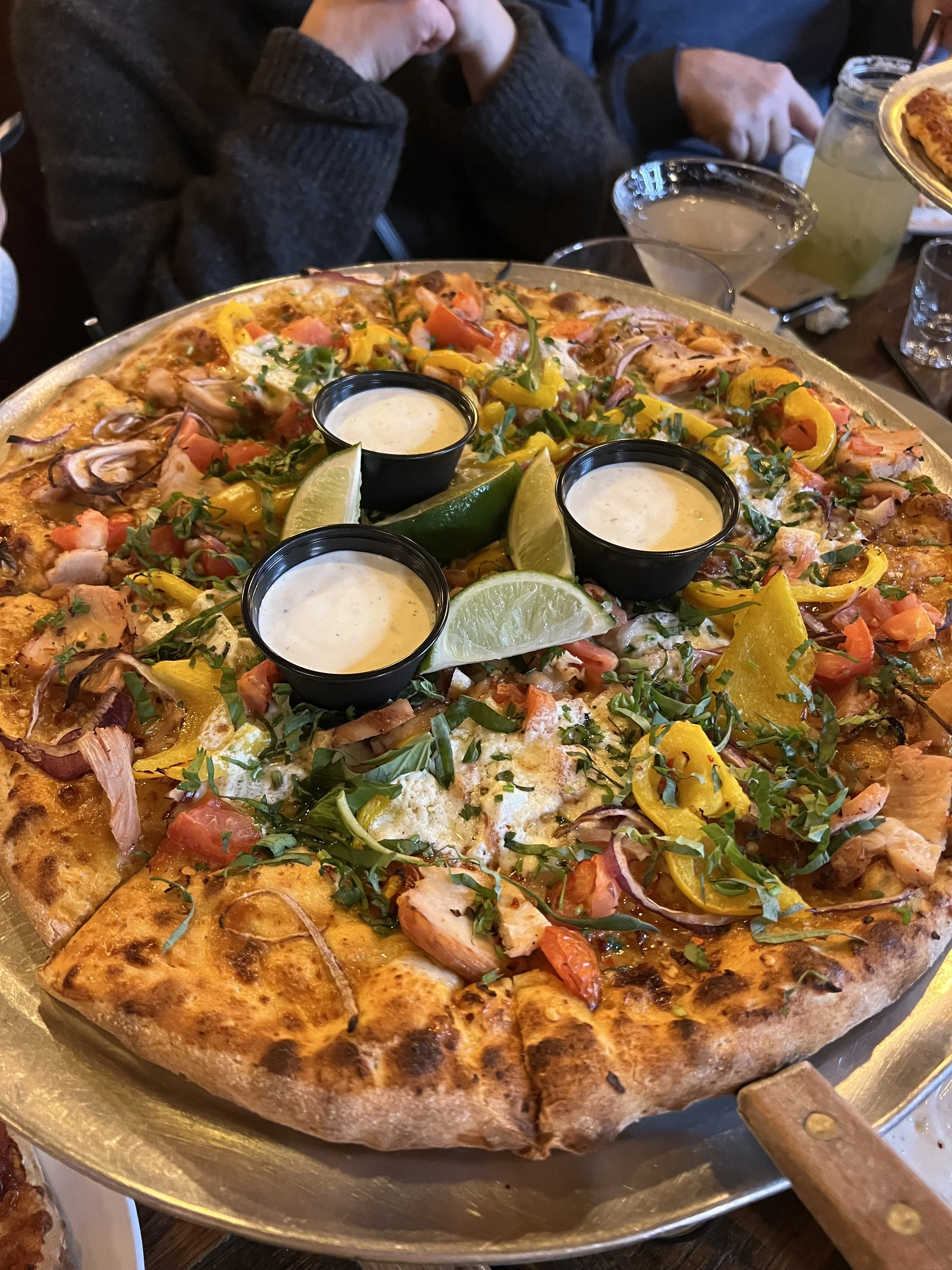 Basecamp Pizza.  One of our favorite pizza places.  The Thai Pizza and Basecamp Pizza are amazing.  Also highly recommend the cadillac margaritas.  Kid friendly, regular music and cornhole. Gets very busy with people coming down from the slopes. 
