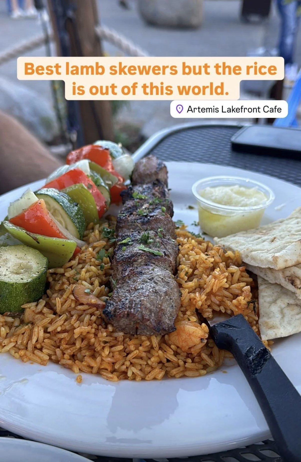 Artemis.  Great Greek food.  I love the rice and the lamb skewers. All the food is good.  The location next to the lake has better ambiance for sitting outside. 