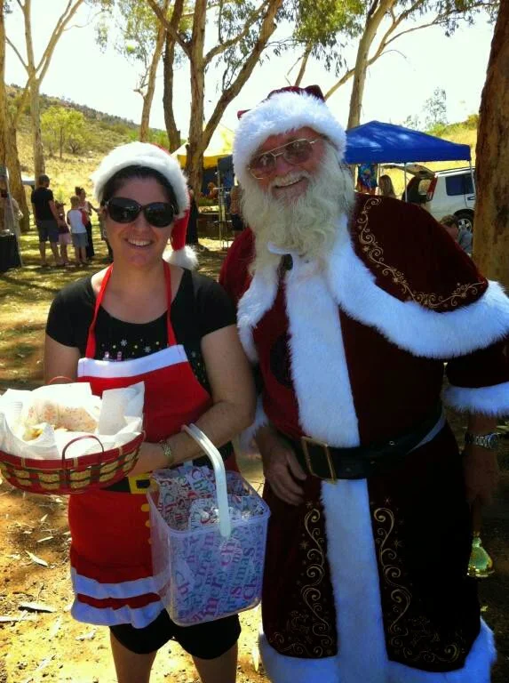Brooke helping Santa at a Christmas market in Alice Springs