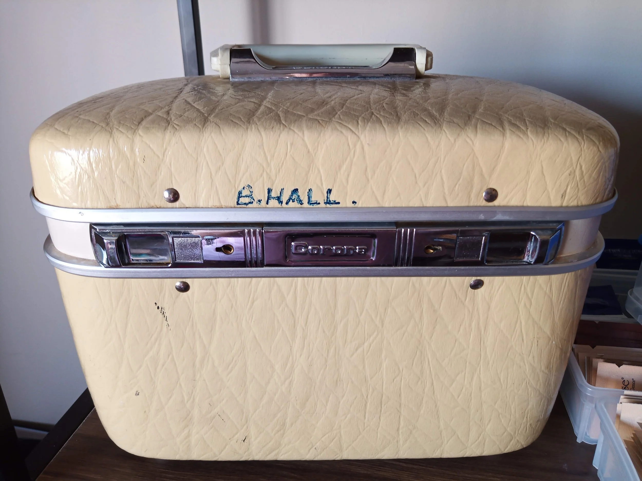 Brooke's original vintage beauty case with B. Hall handwritten on the front