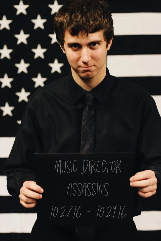 Conor as the Music Director of Assassins his first semester at Boston College.
