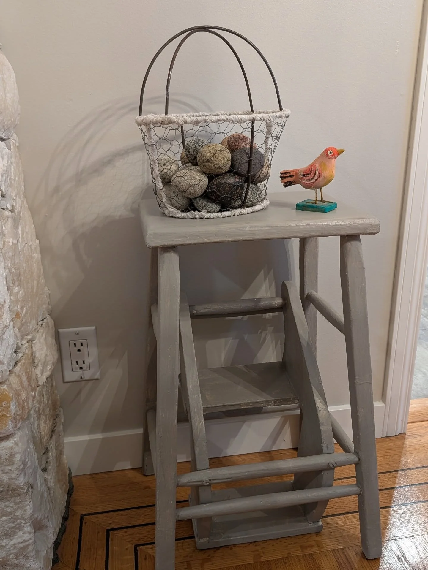 Just refurbished this antique stepping stool. Too bad I didn't take the before picture. It was ugly, dirty beige with navy blue chipped paint spots underneath. I used my favorite #anniesloanchalkpaint&reg; and wax in a light gray color. Now that I'm 