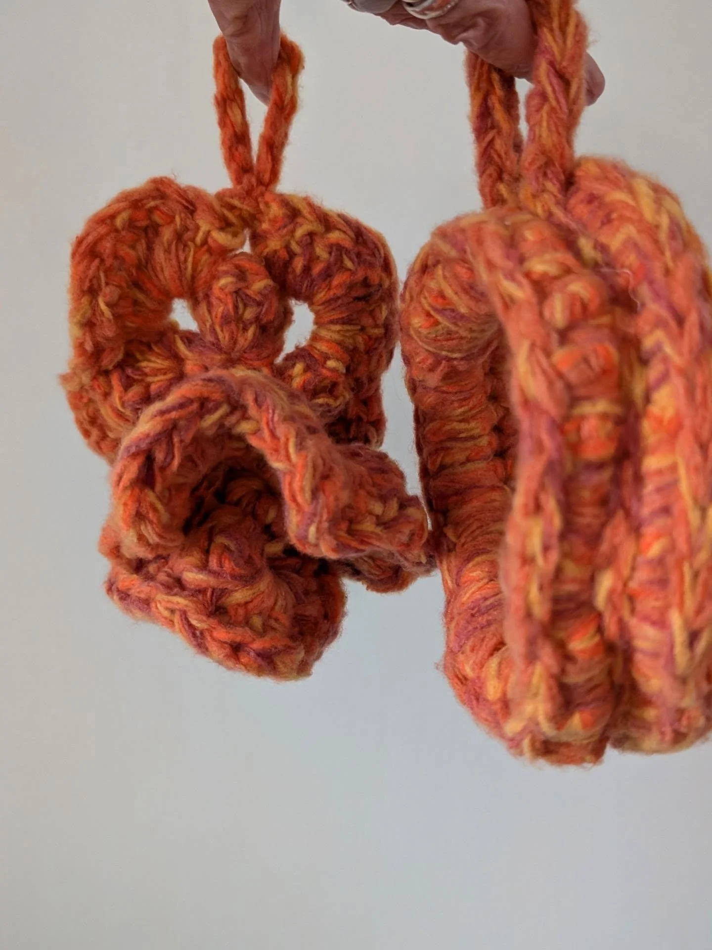 Never thought I'd make something this odd.. What are those gnarly things? I had leftover yarn... I began to crochet thick, multi layered shapes until all the yarn was used up. Just went with the flow, creating on the fly, one round at the time, They 