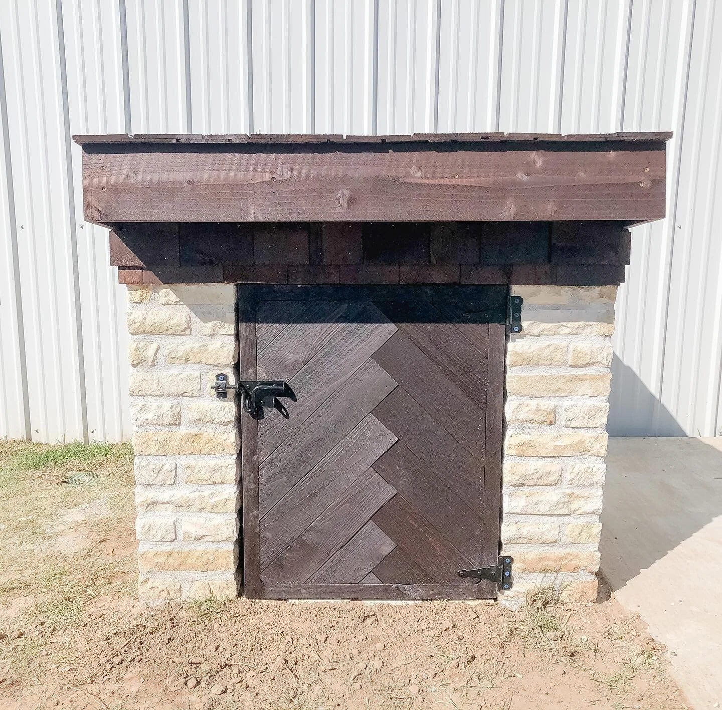 Custom well house with unique design elements.