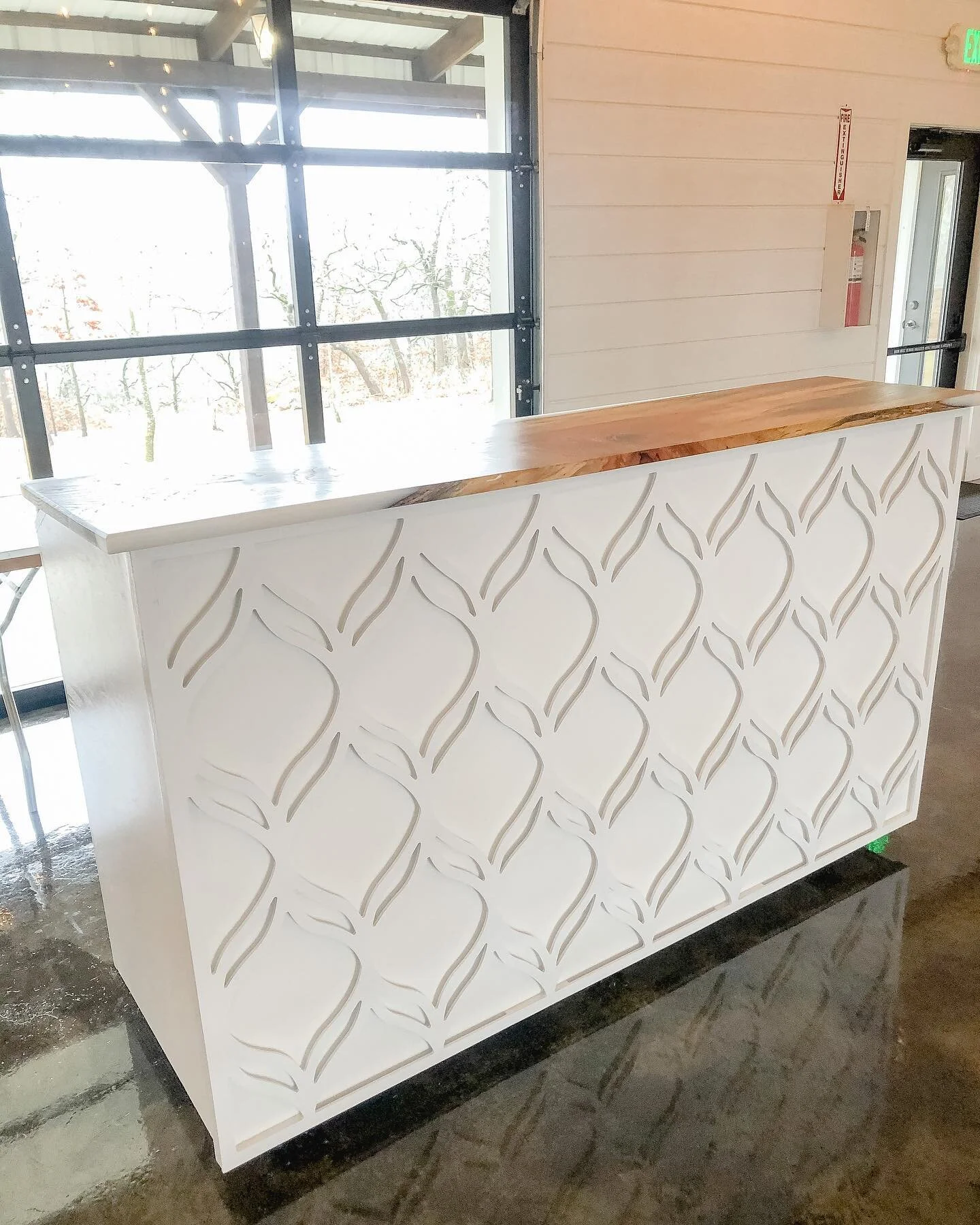 Custom, handmade movable bar. The top has an acrylic epoxy edging with bow tie accents. The wheels provide easy movability when transitioning spaces. An absolute stunner. Pieces like this are available now for a custom quote.
