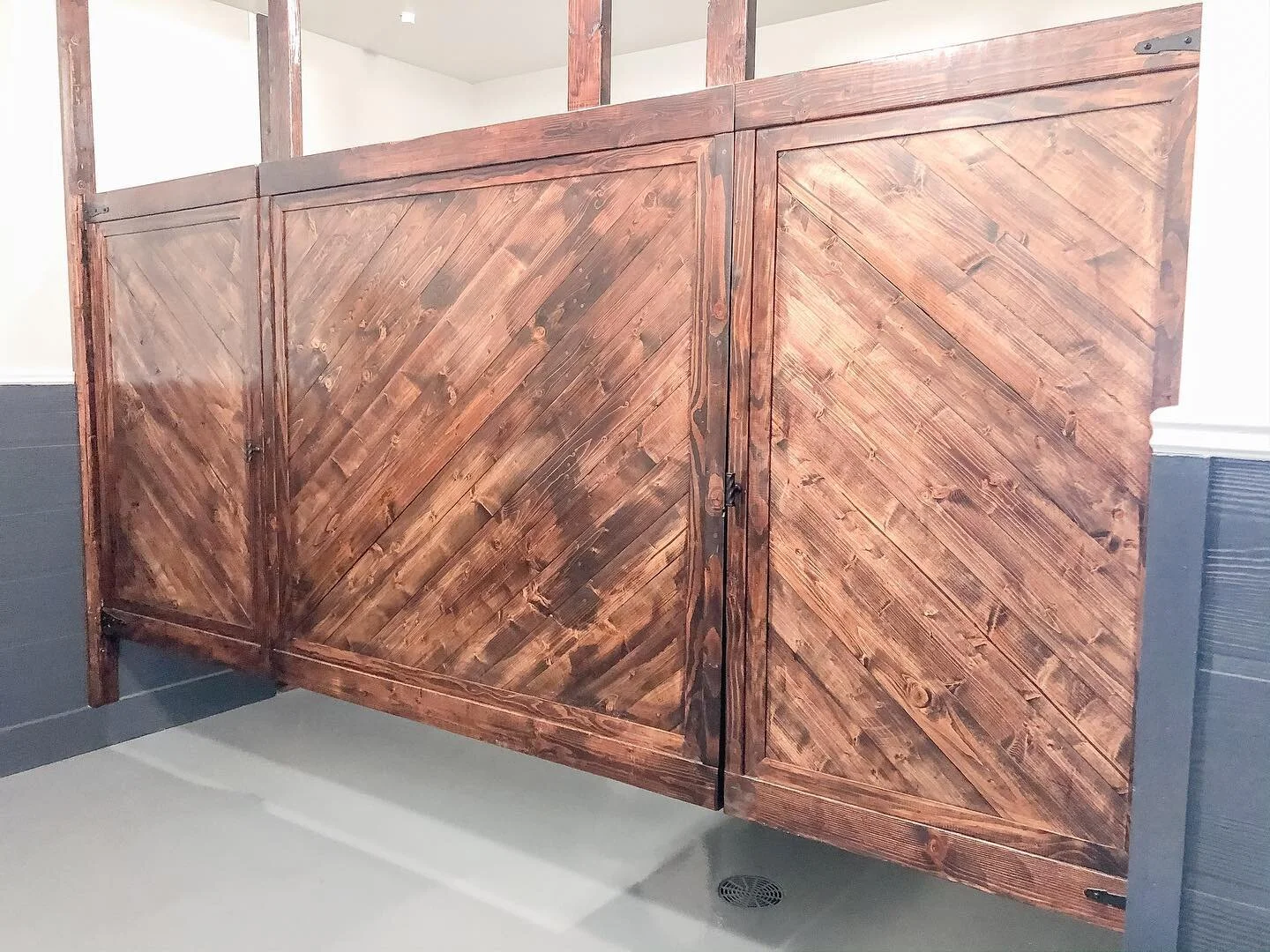 Handmade restroom stall dividers create beauty in an often-overlooked space.